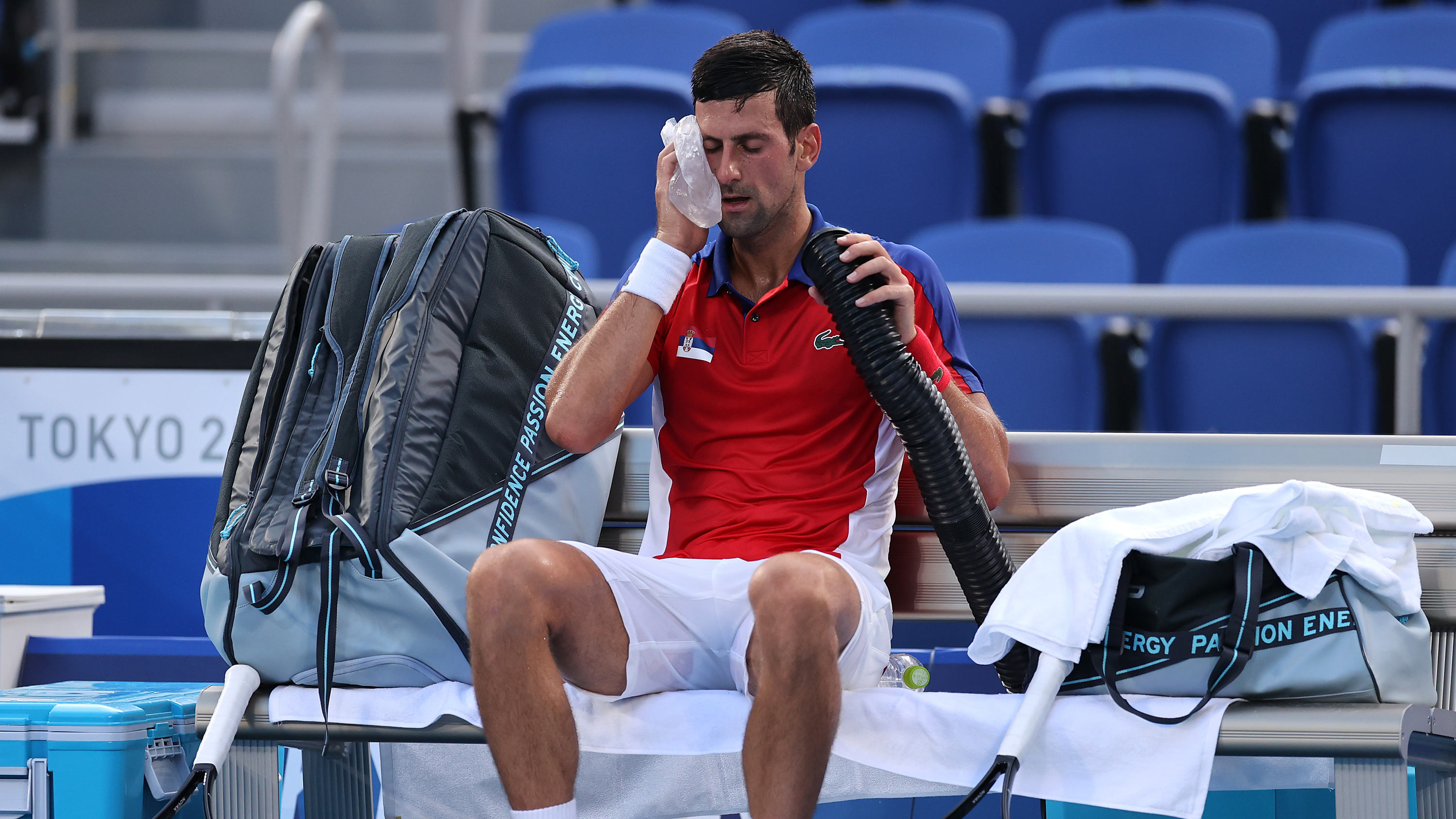Serbia's Novak Djokovic attempts to keep cool between games on July 28.