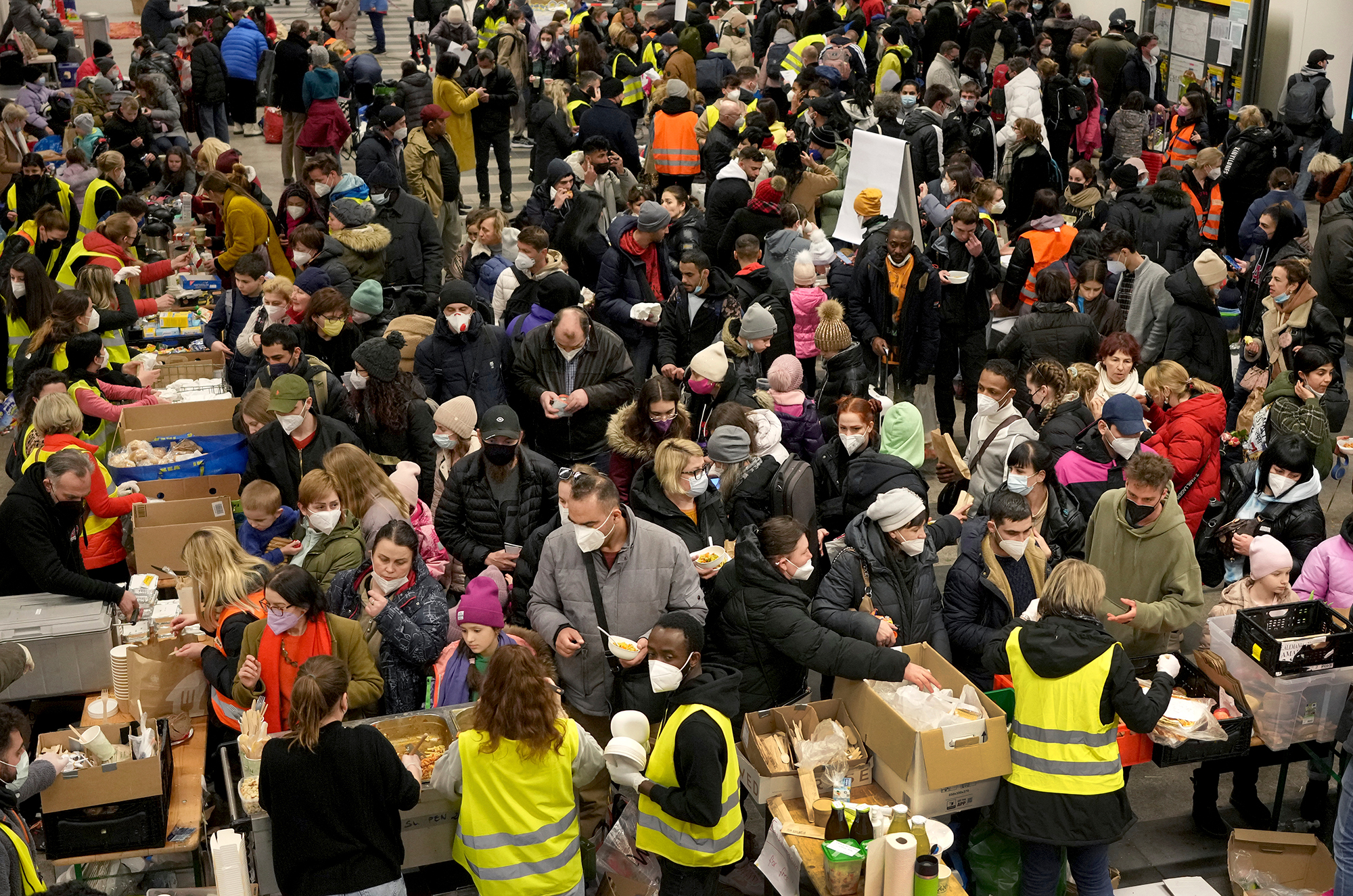 Ukrainian refugees queue for food after their arrival at the main train station in Berlin, Germany on March 8. 