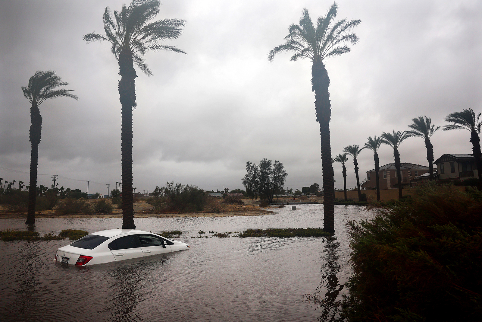 A car is partially submerged in floodwaters in Cathedral City, California on August 20.