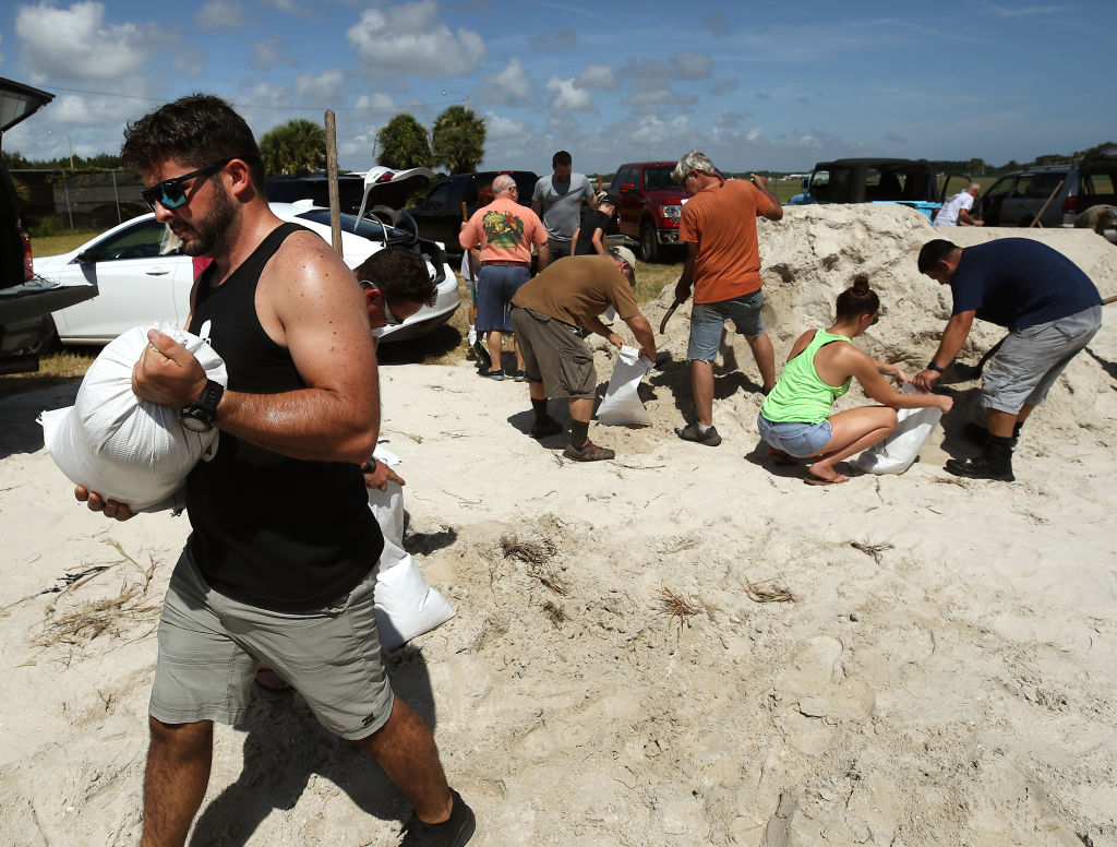 People prepare sandbags at a municipal center as Hurricane Dorian approaches Florida.