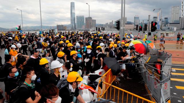 Protesters set up barricades in Hong Kong ahead of a day of marches and demonstrations on July 1, 2019.