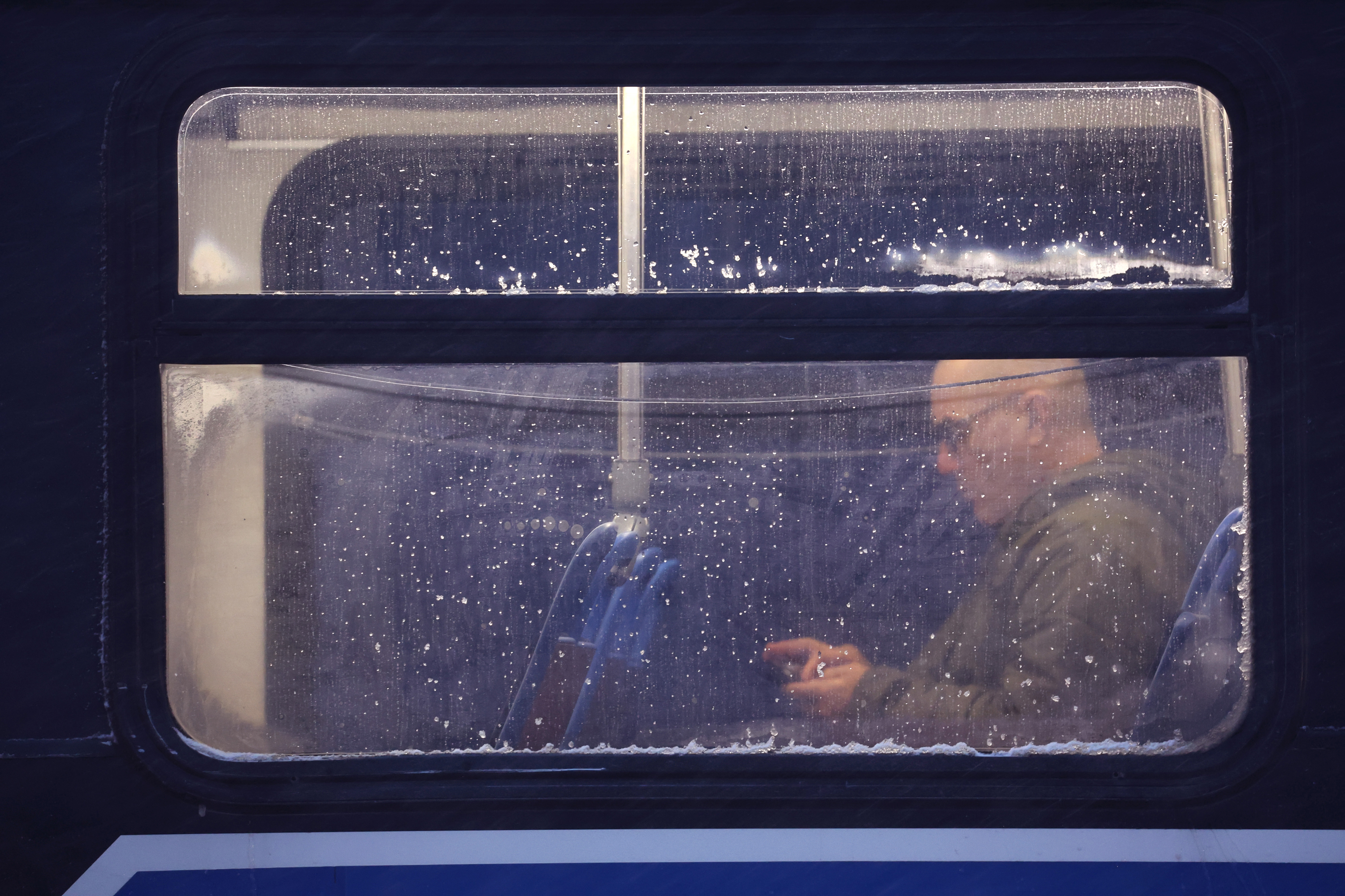 A commuter sits on a city bus as temperatures drop in Chicago, Illinois on Thursday.