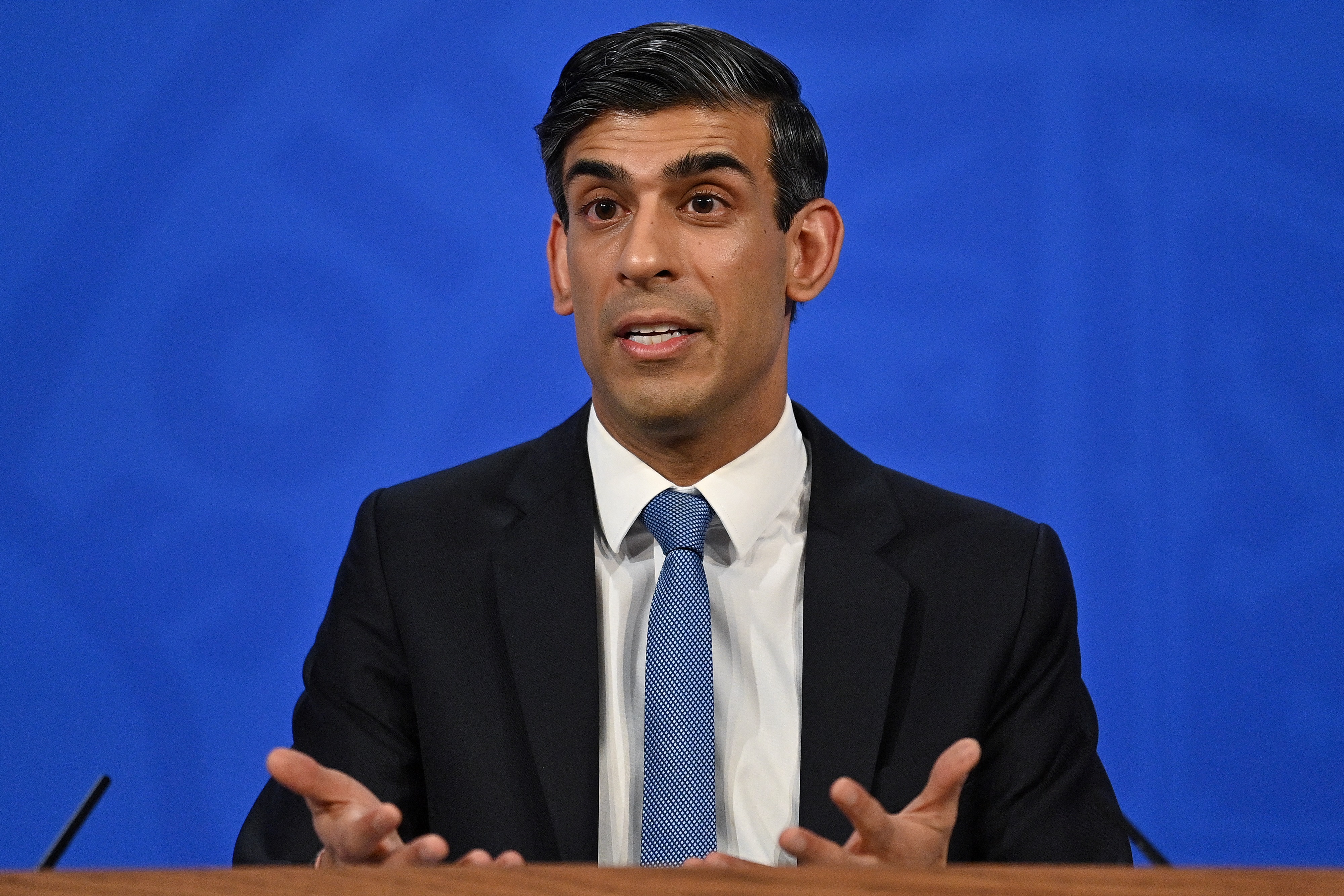 Britain's Chancellor of the Exchequer Rishi Sunak hosts a press conference in the Downing Street briefing room on February 3 in London, England.