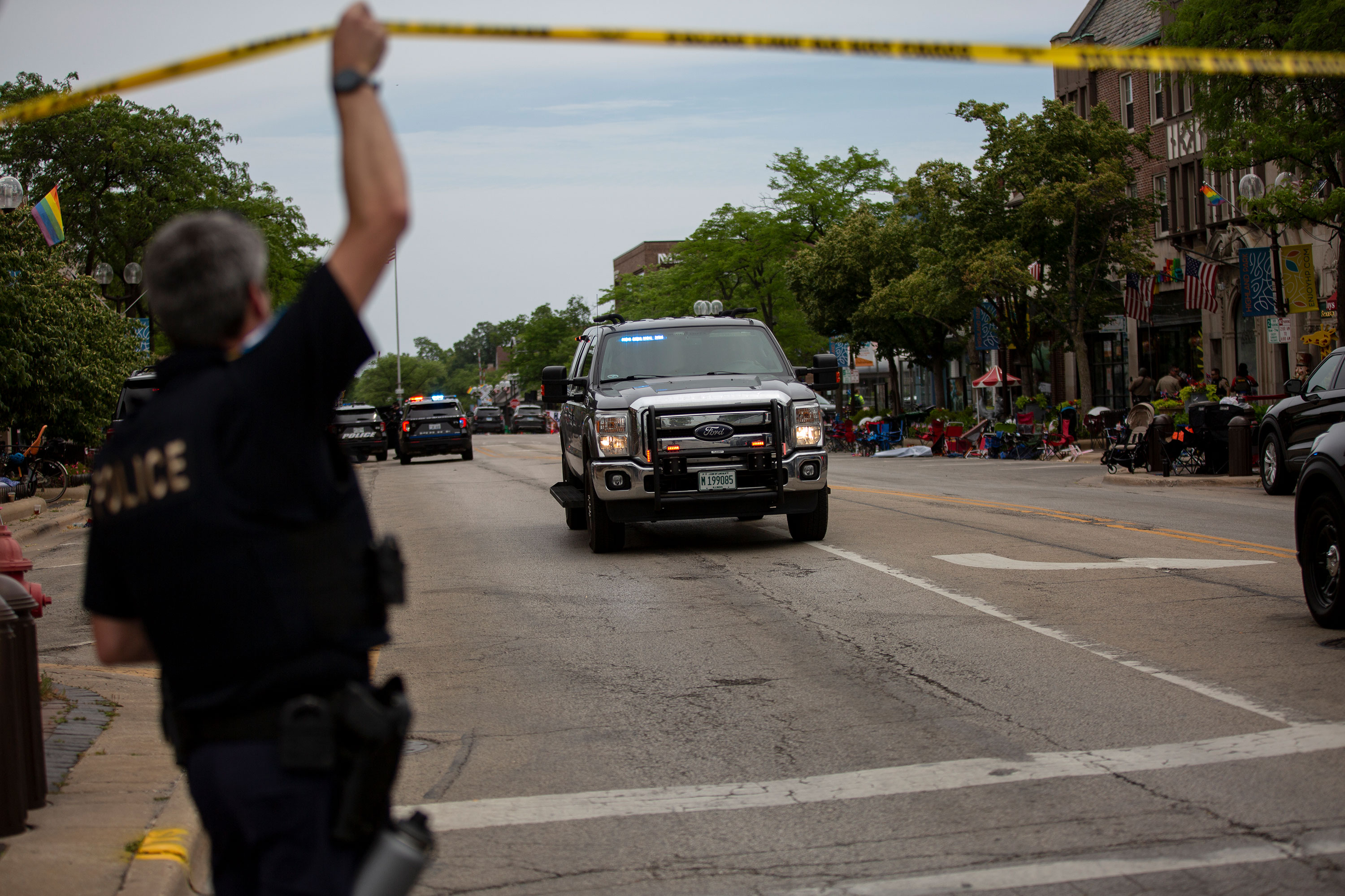 Police work at the scene of the shooting on Monday.