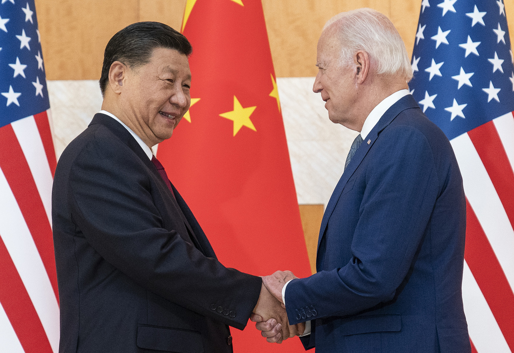 U.S. President Joe Biden, right, and Chinese President Xi Jinping shake hands before a meeting on the sidelines of the G20 summit meeting, on November 14, in Bali, Indonesia.
