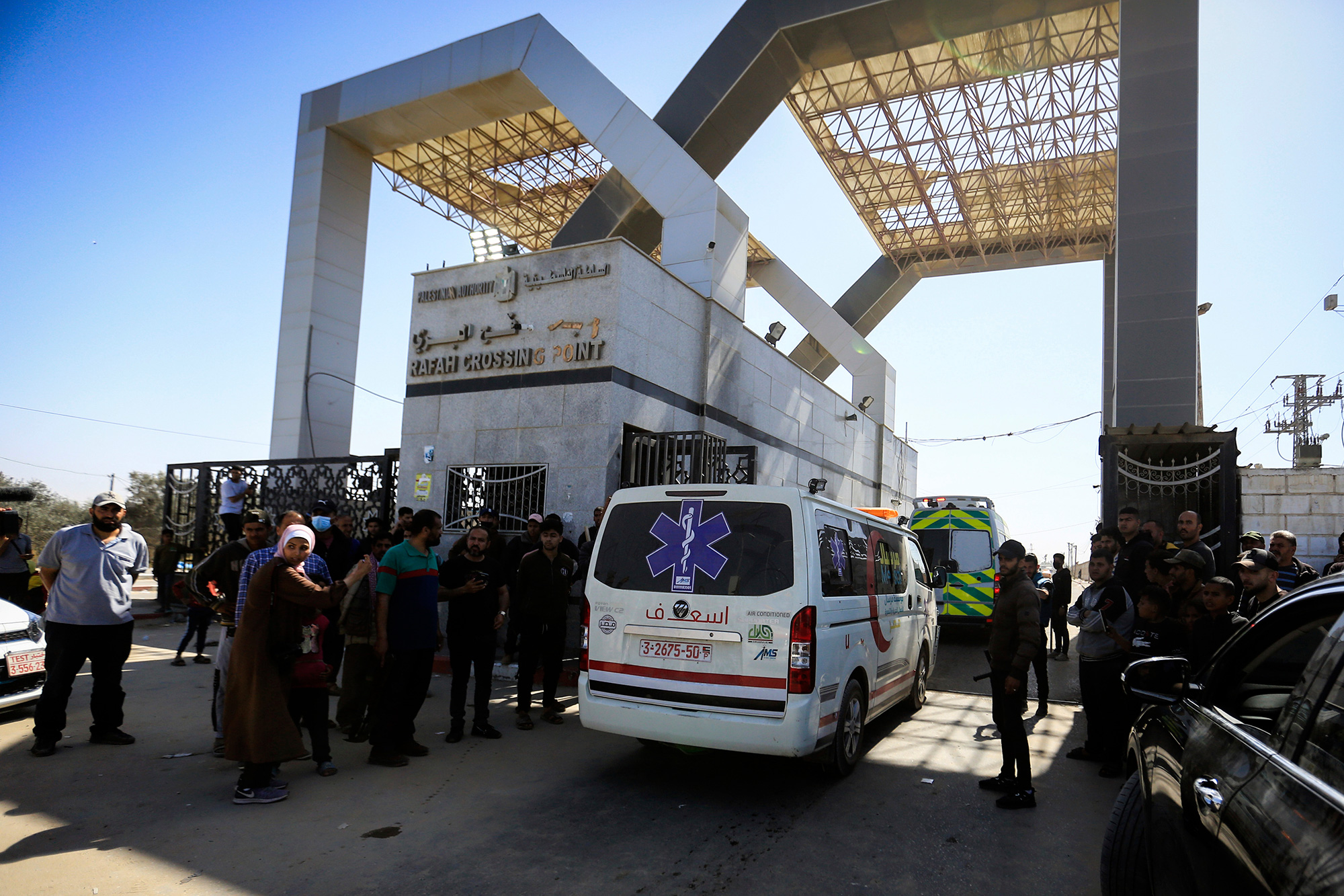 Ambulances go through the Rafah border crossing into Egypt, on April 3. 