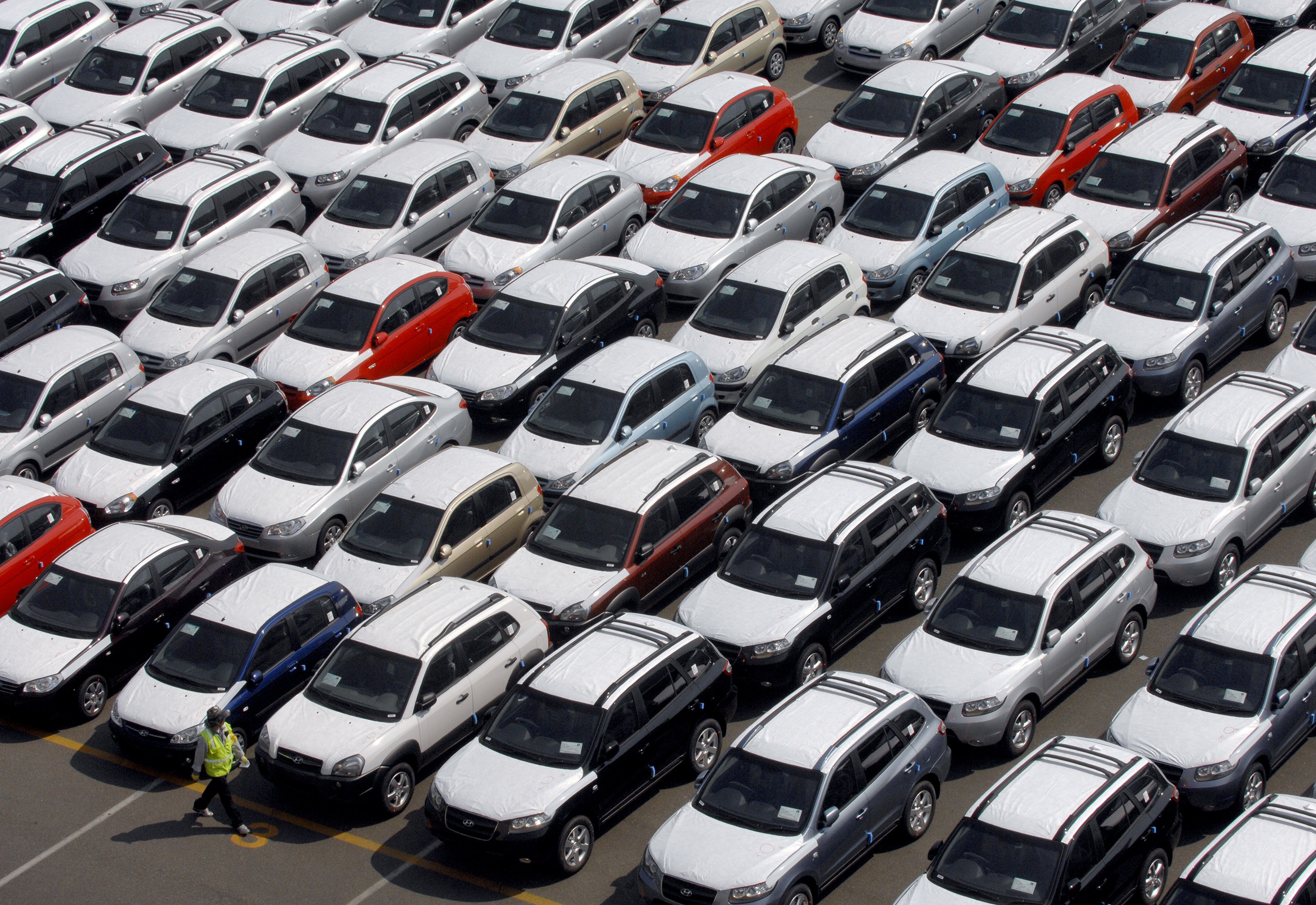Rows of Hyundai Motor cars parked for shipping in the southeastern port of Ulsan.