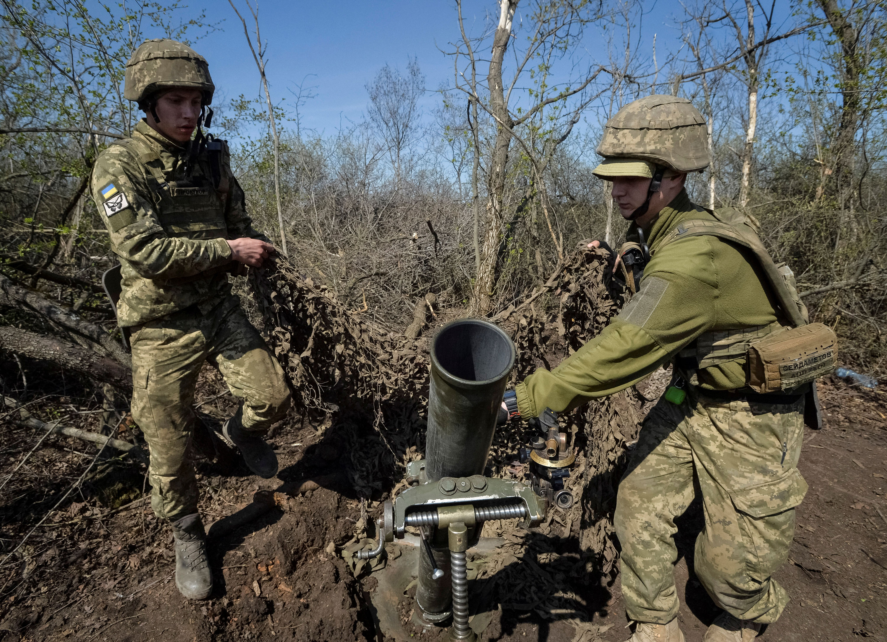 Ukrainian servicemen prepare to fire a mortar on a front line, amid Russia's attack on Ukraine, near the front line city of Bakhmut, Ukraine on April 10, 2023.