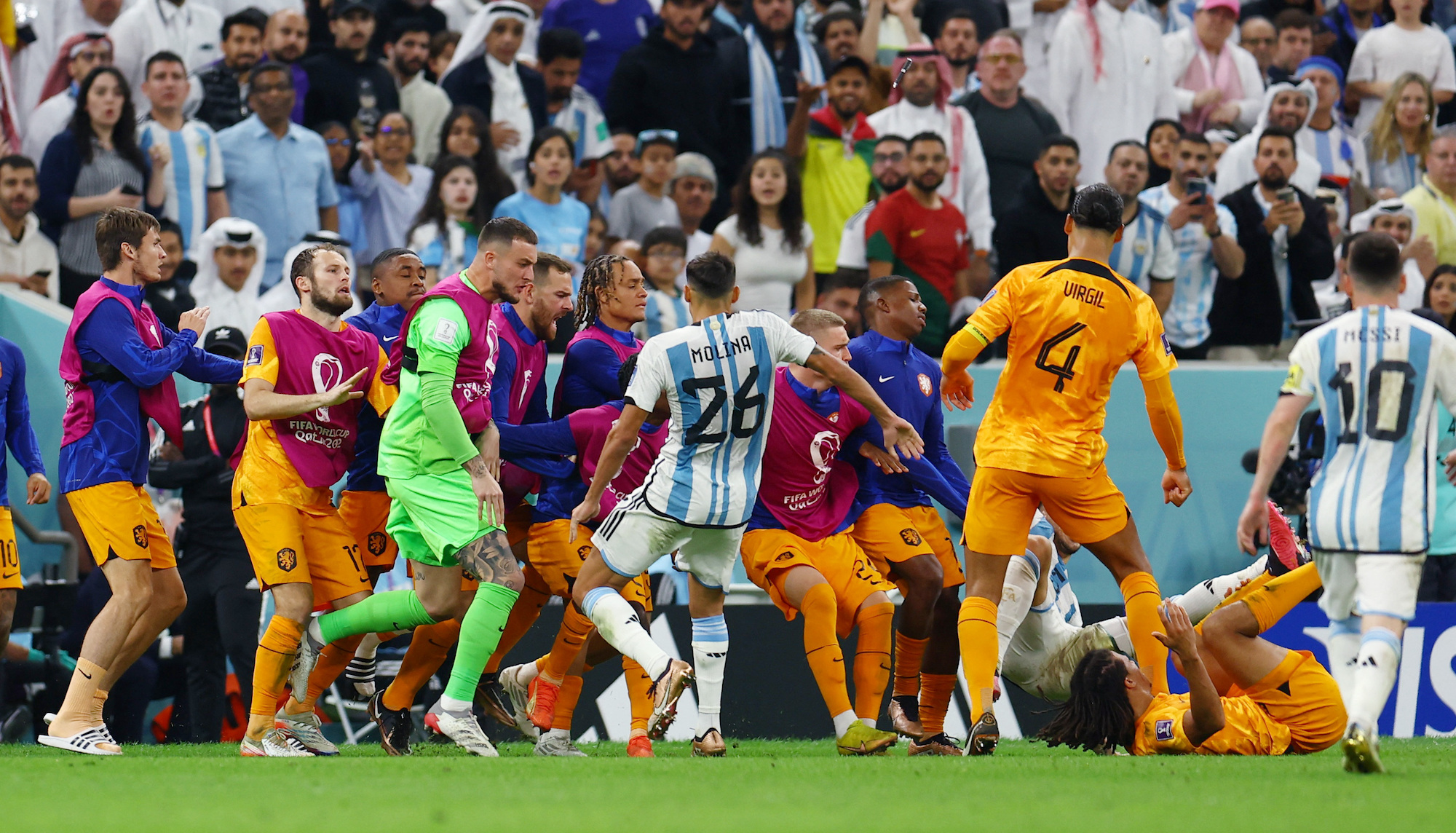 Players clash after an Argentine ball launched into the Dutch bench.