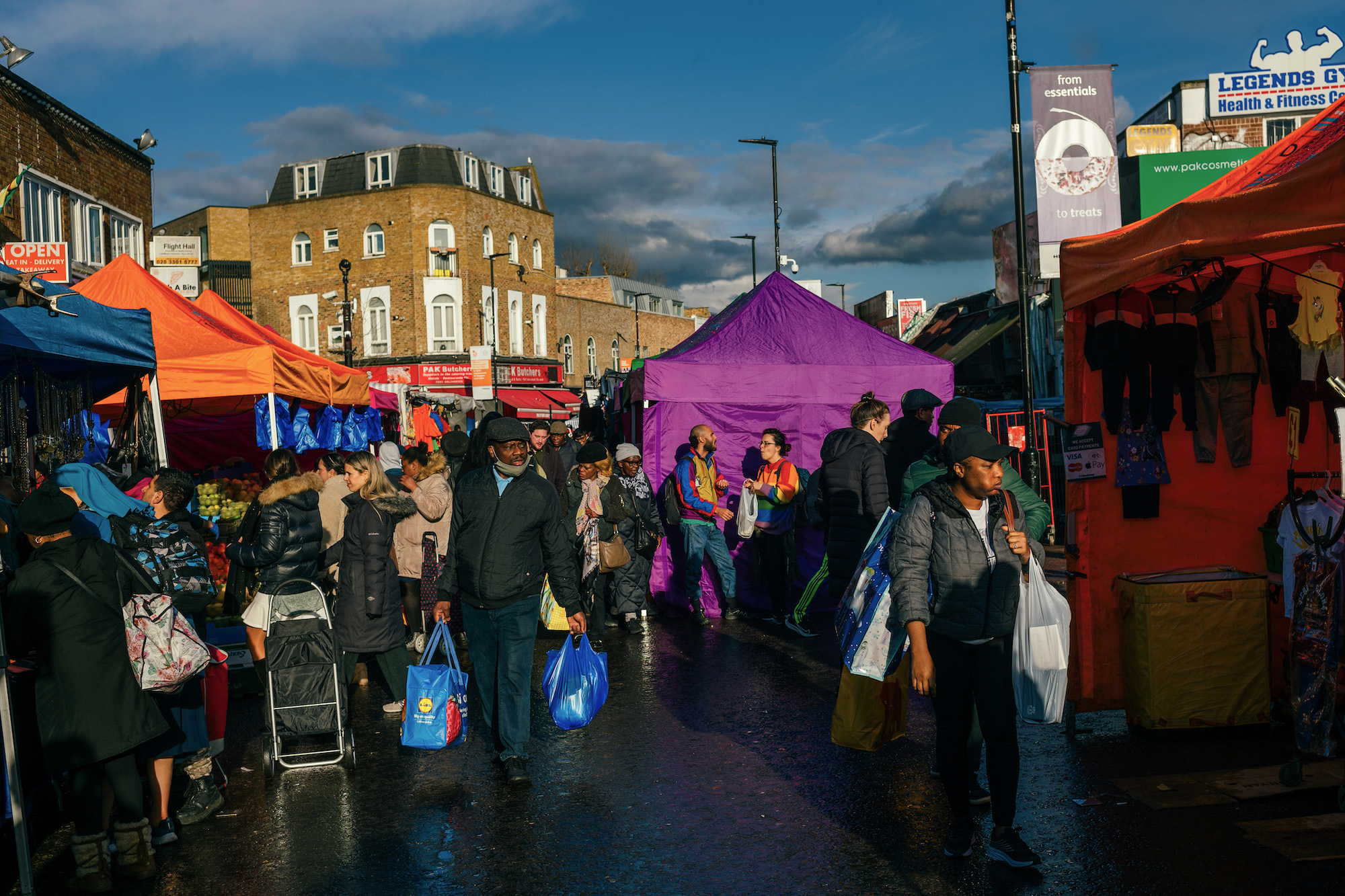 Shoppers browse stalls at Ridley Road Market in the Hackney district of London, UK, on March 18. 