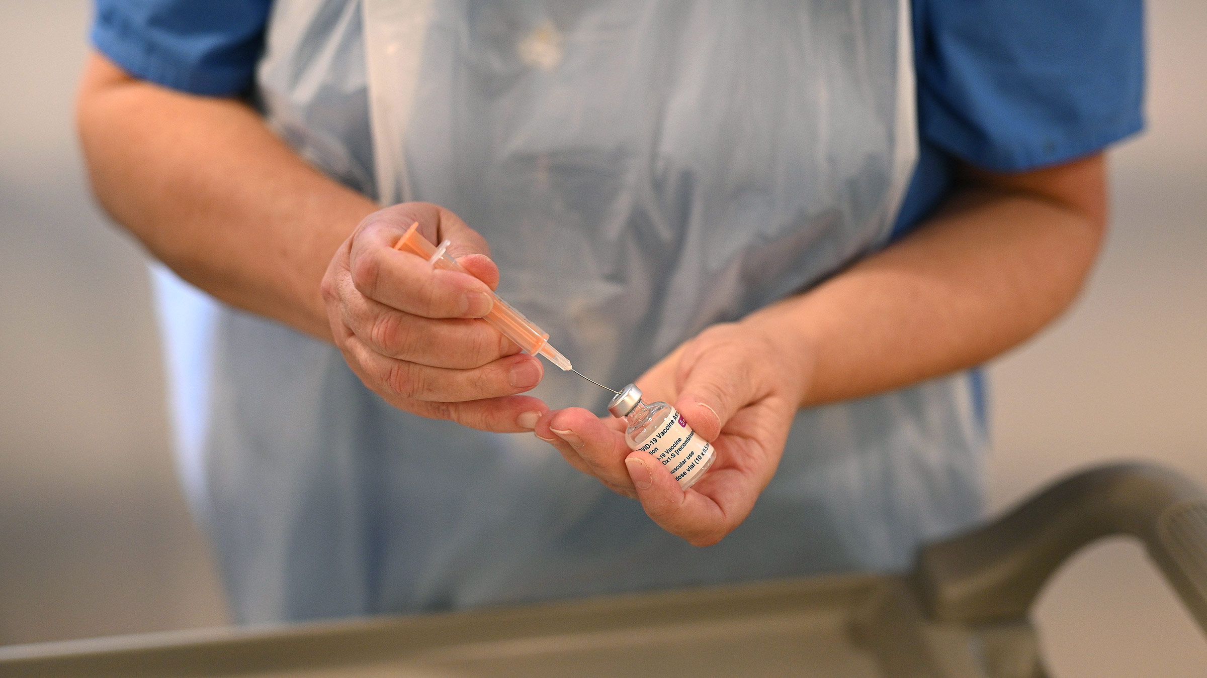 A nurse practitioner prepares a dose of the Oxford/AstraZeneca Covid-19 vaccine in Crewe, England, on January 14. 