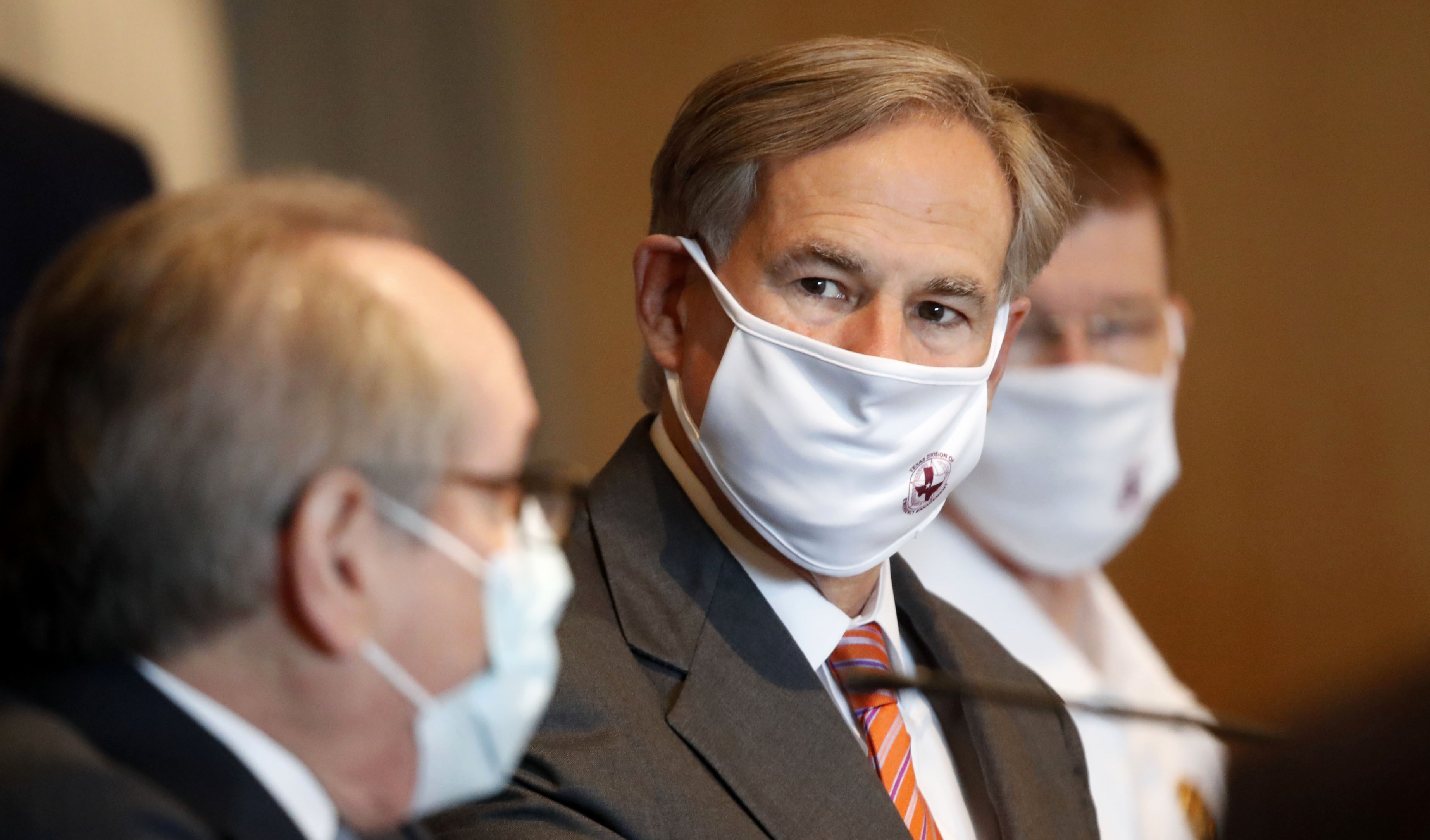 Texas Gov. Greg Abbott attends a news conference in Dallas on August 6.