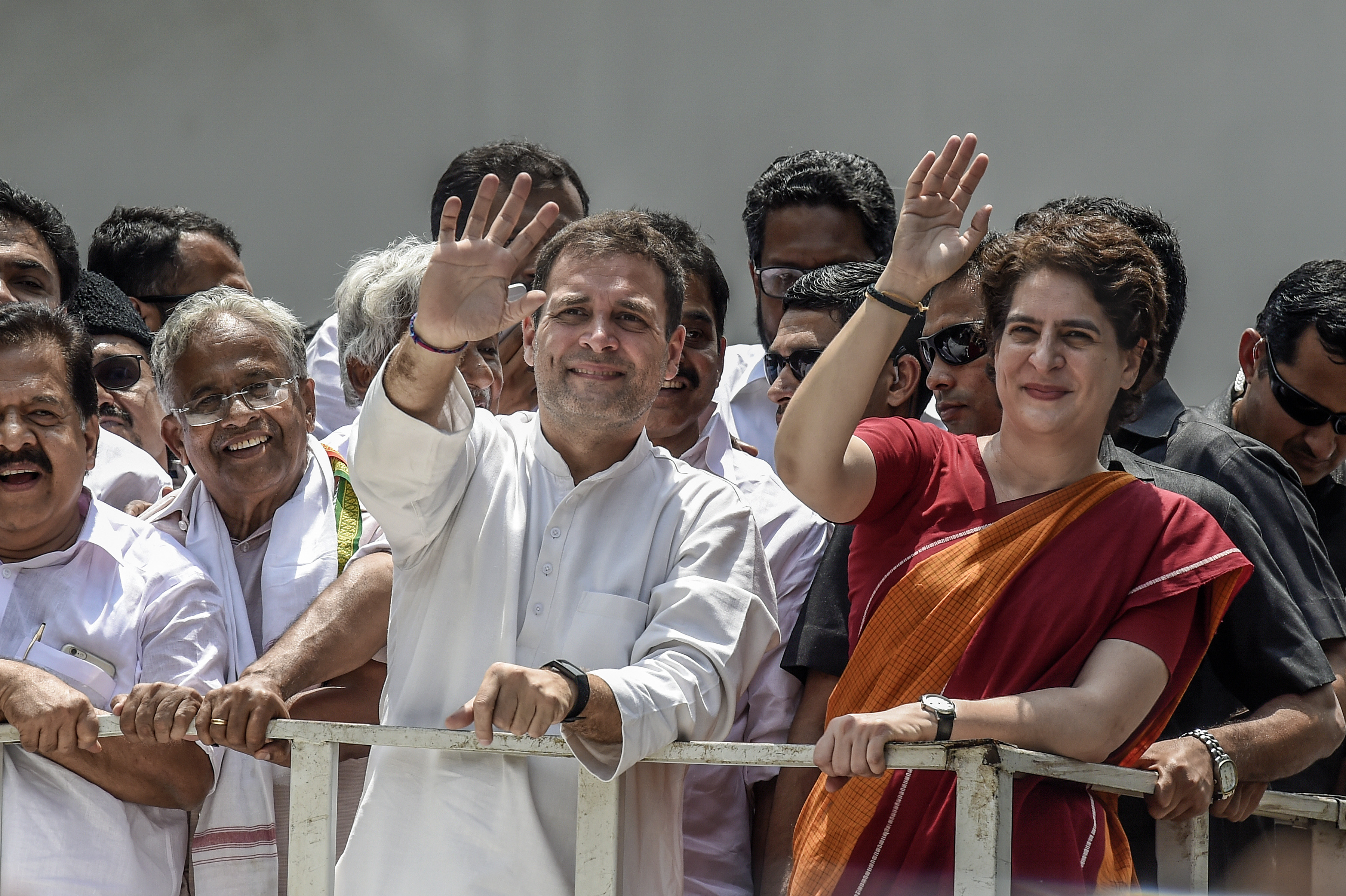 Rahul Gandhi and his sister, Priyanka Gandhi, wave at crowds in April this year.