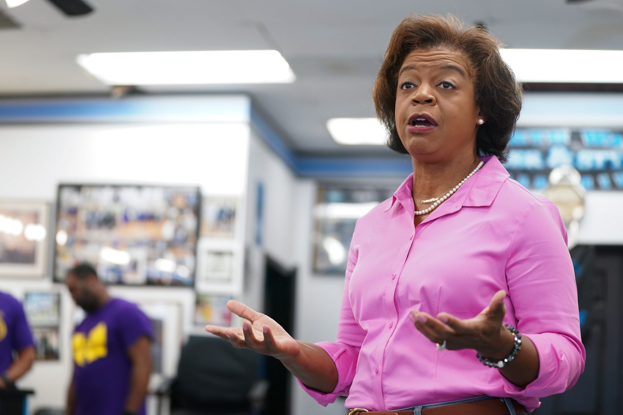 Cheri Beasley speaks with potential voters at Fourth Ward Barber & Hairstyle on September 17 in Charlotte, North Carolina.