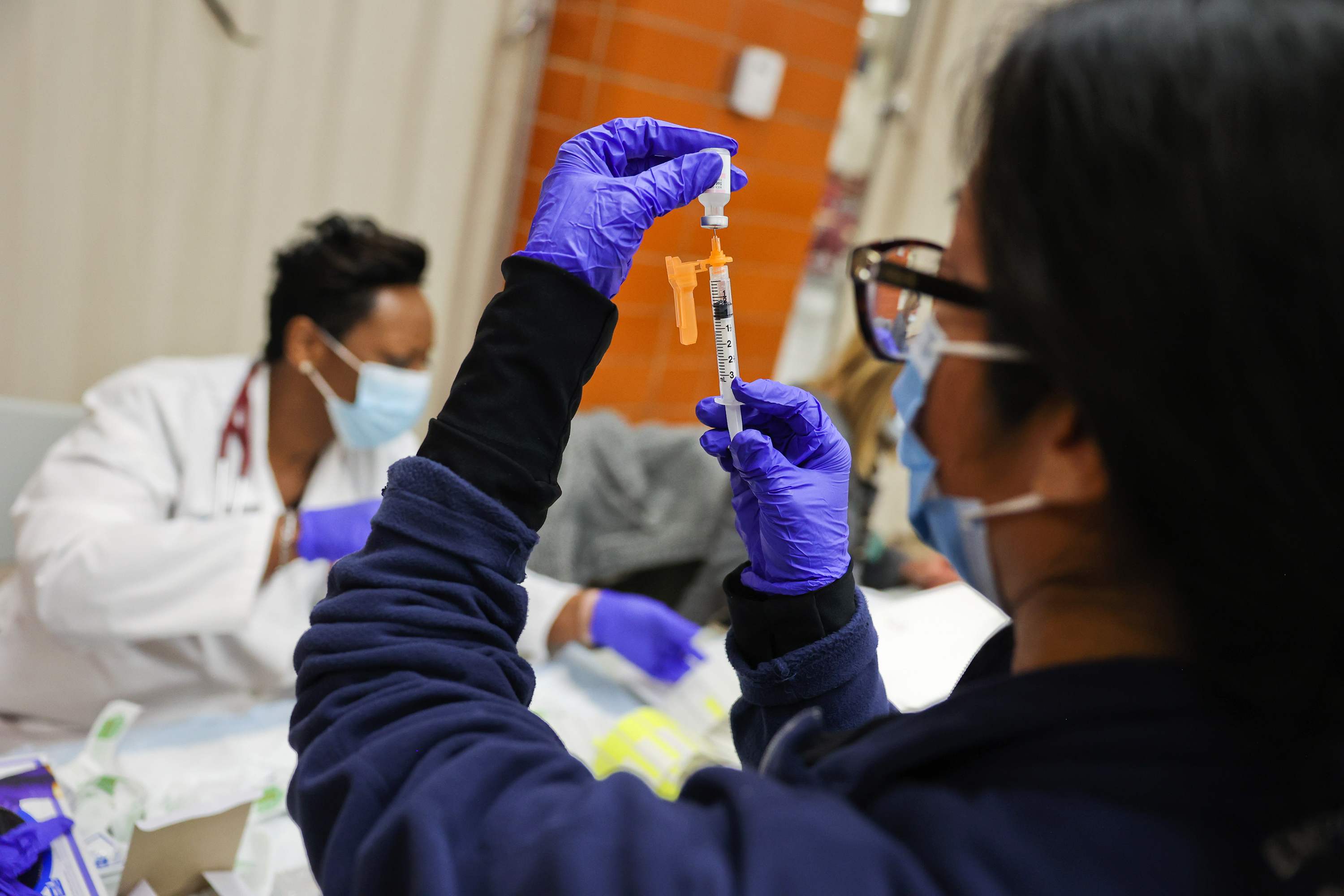 Dr. Twana Jackson prepares a Covid-19 vaccine in Freeport, New York, on November 30. 