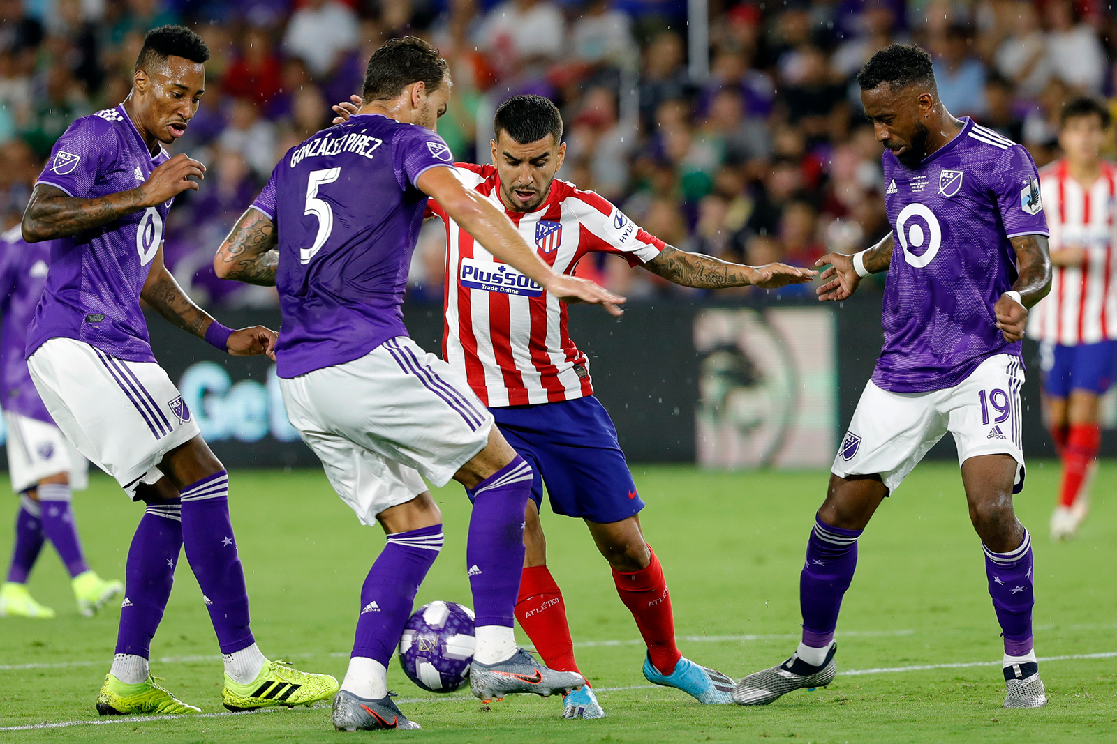 Leandro Gonzalez Pirez of MLS All-Stars and Angel Correa of Atletico de Madrid battle for the ball during the 2019 MLS All-Star Game between MLS All Stars and Atletico de Madrid at Exploria Stadium in Orlando, Florida on July 31, 2019.