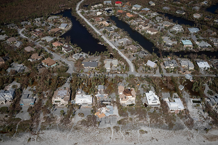 An aerial picture taken on September 30, shows damaged houses in the aftermath of Hurricane Ian in Sanibel, Florida. 