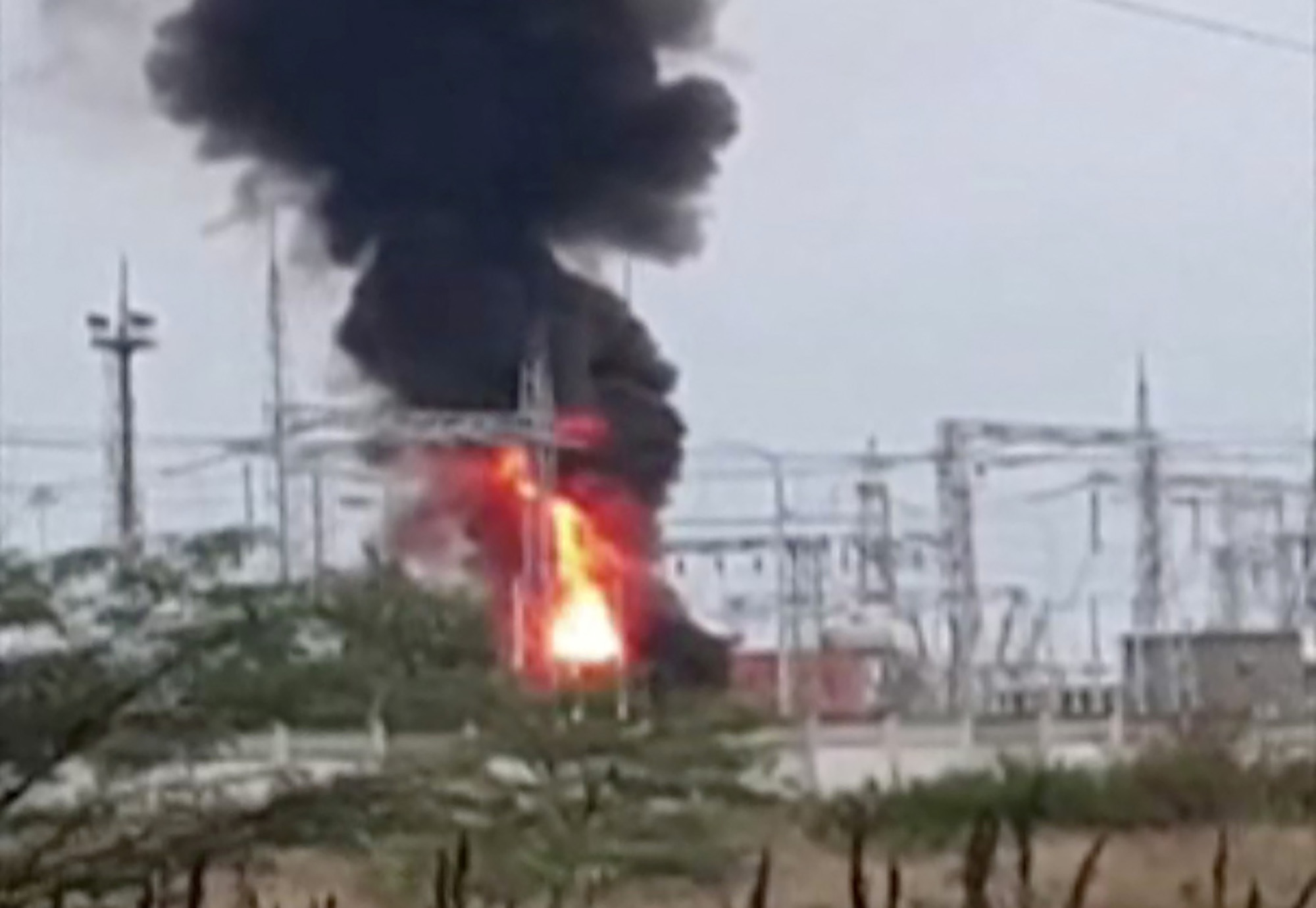 Smoke rises above a transformer electric substation which caught fire after a blast in the Dzhankoi district, Crimea on August 16. 