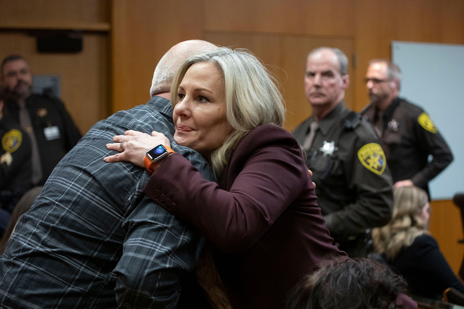 Oakland County Prosecutor Karen McDonald hugs Craig Shilling after a jury found Jennifer Crumbley guilty on four counts of involuntary manslaughter on Tuesday at Oakland County Circuit Court in Pontiac, Michigan. 