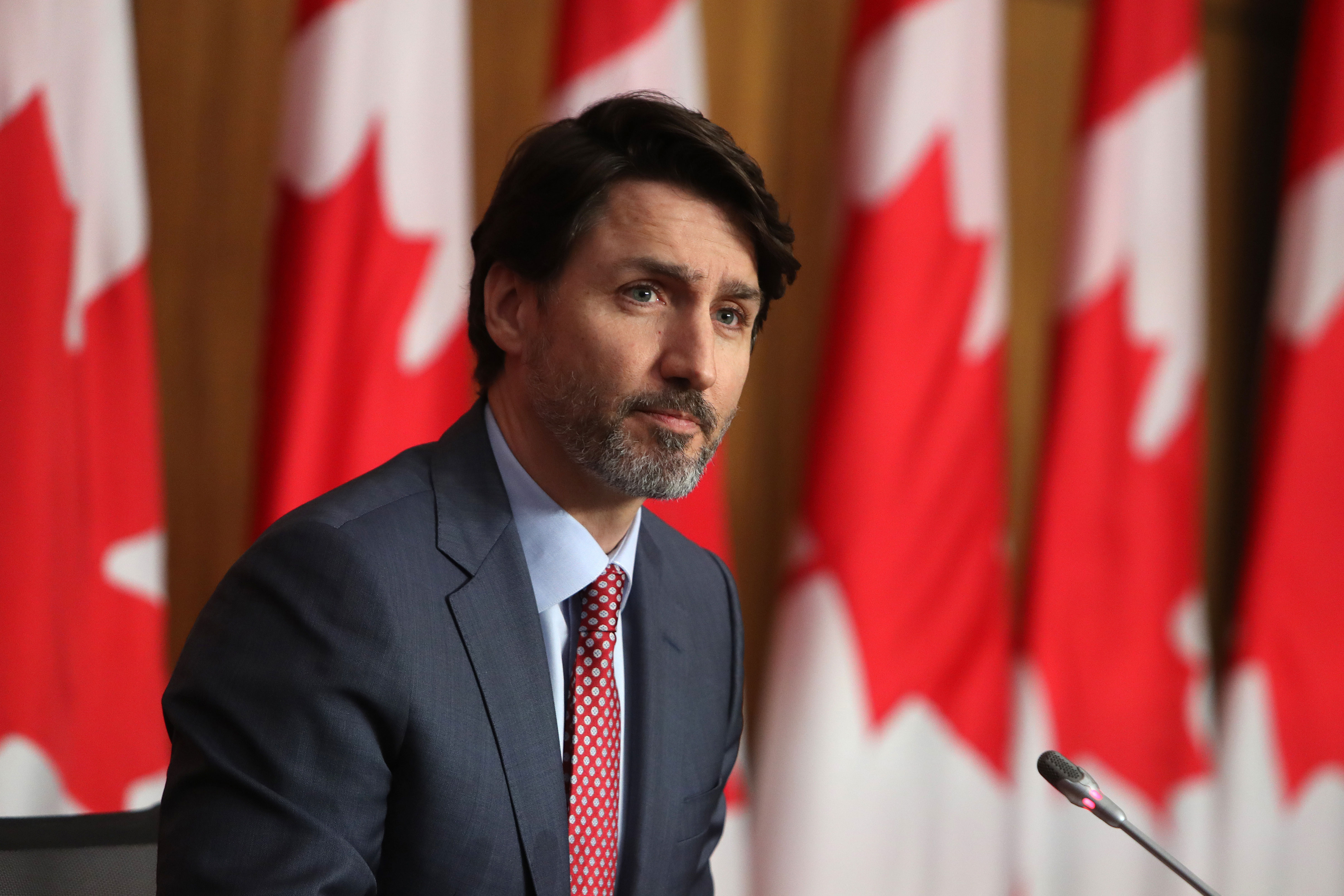 Canadian Prime Minister Justin Trudeau listens during a news conference in Ottawa on March 19, 2021.