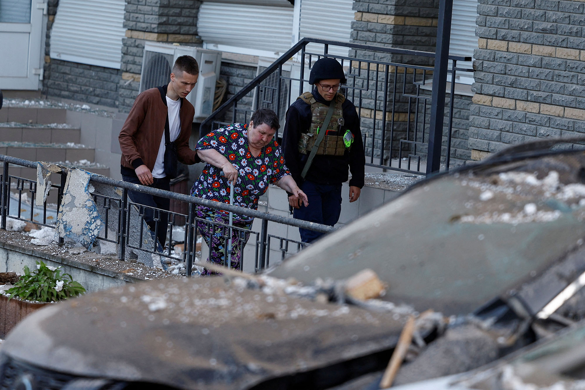 A woman is evacuated from an apartment building heavily damaged during a Russian drone strike in Kyiv, Ukraine, on May 30.