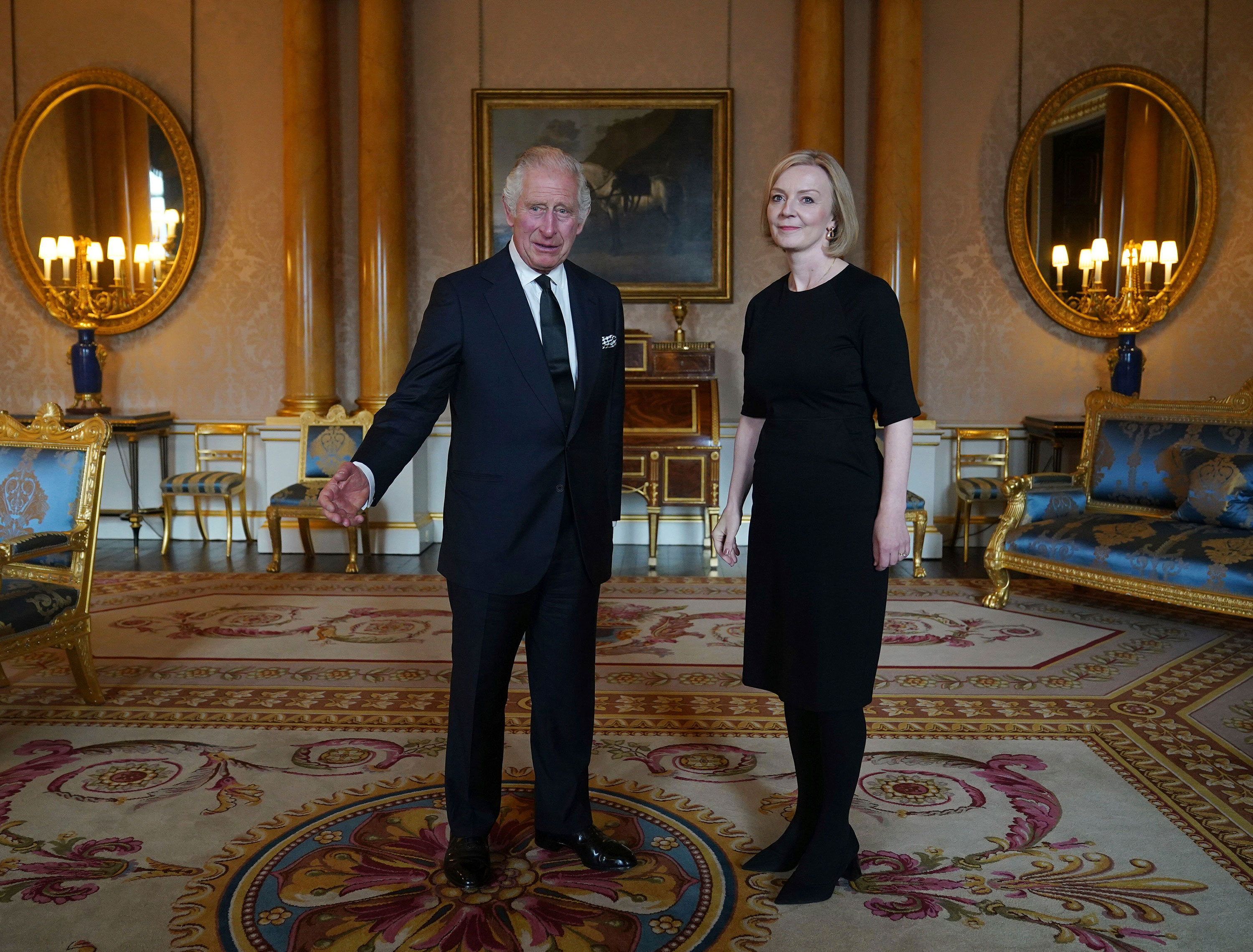 King Charles III speaks with Prime Minister Liz Truss during their first meeting at Buckingham Palace on Friday.