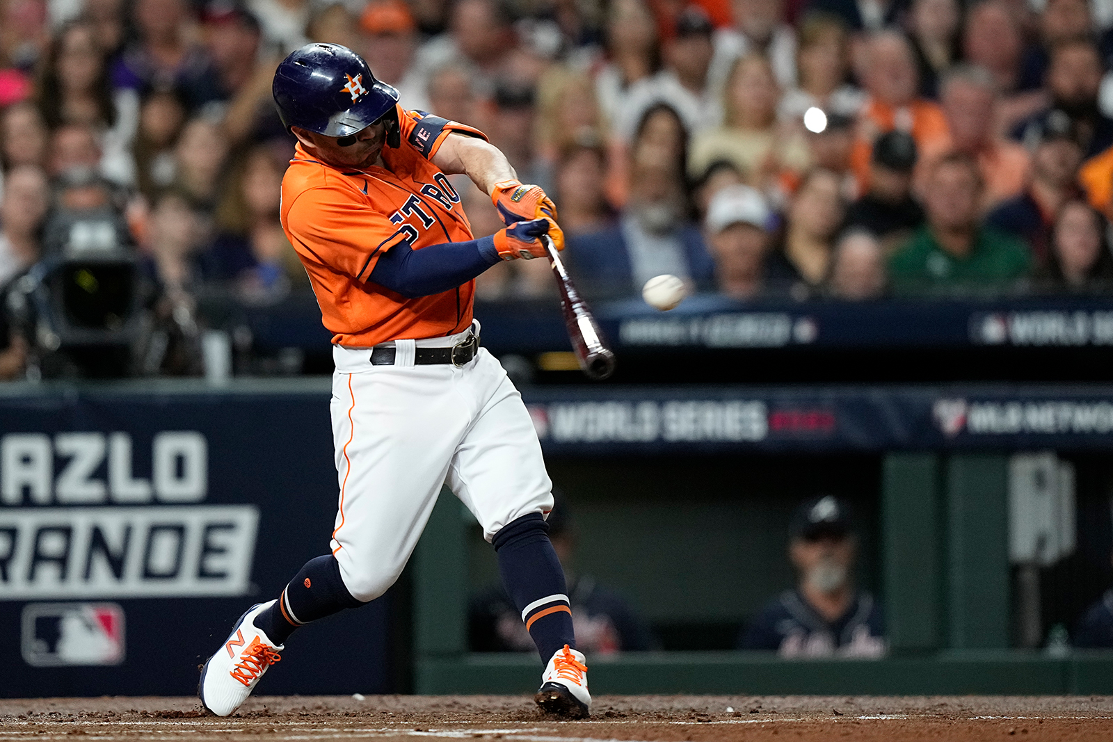 Houston Astros' Jose Altuve hits a double during the first inning in Game 2.