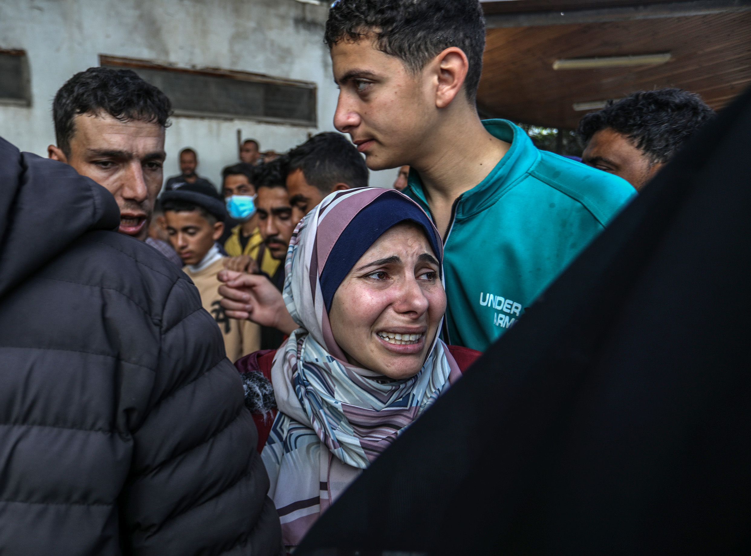 Relatives of the dead Palestinians mourn as the bodies are brought to the An-Najjar Hospital after Israeli army attacked the United Nations Relief and Works Agency for Palestine Refugees in the Near East (UNRWA) building in Rafah, Gaza on March 13.