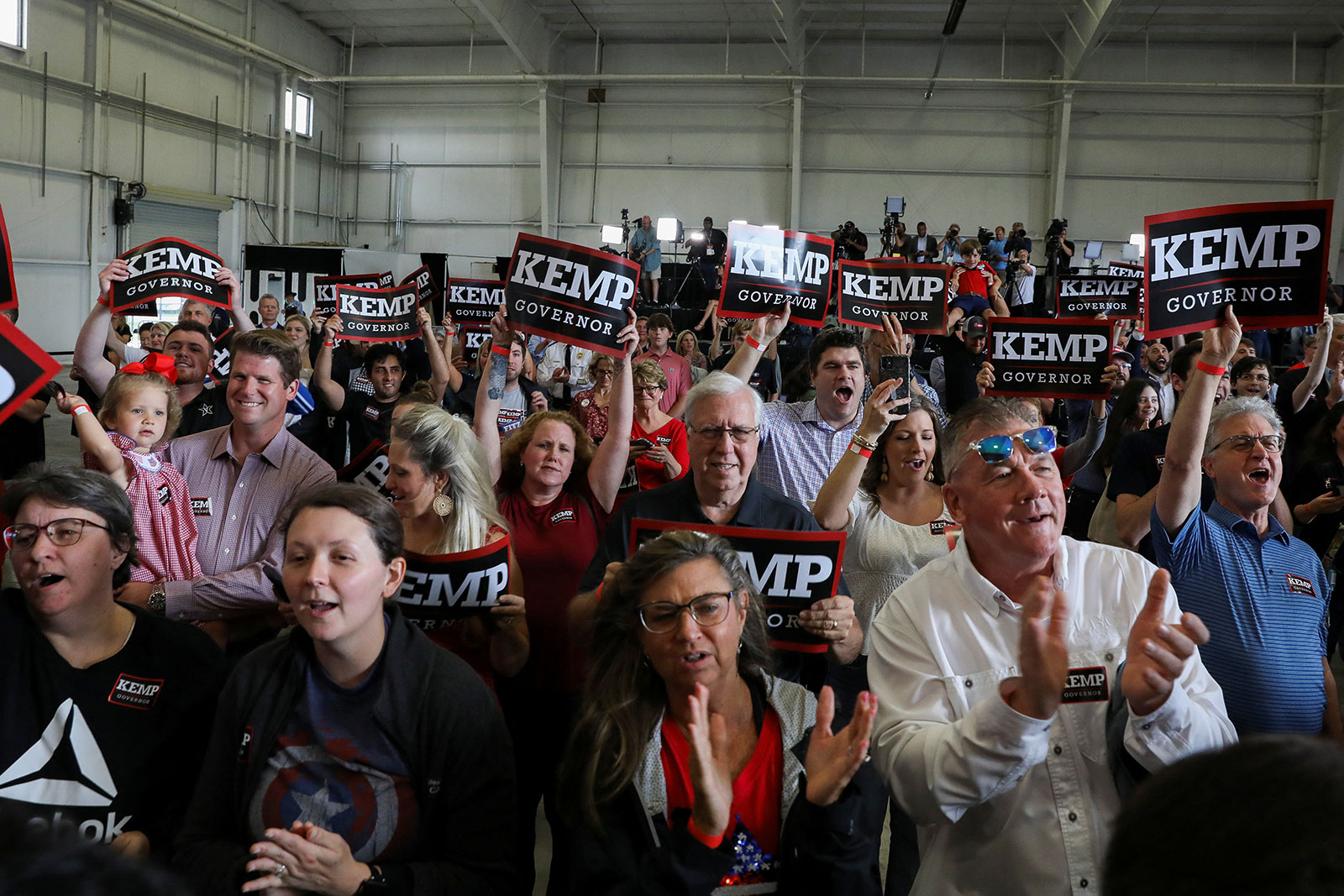 People attend a rally for Georgia Gov. Brian Kemp ahead of the state's primary election in Kennesaw, Georgia, on May 23.