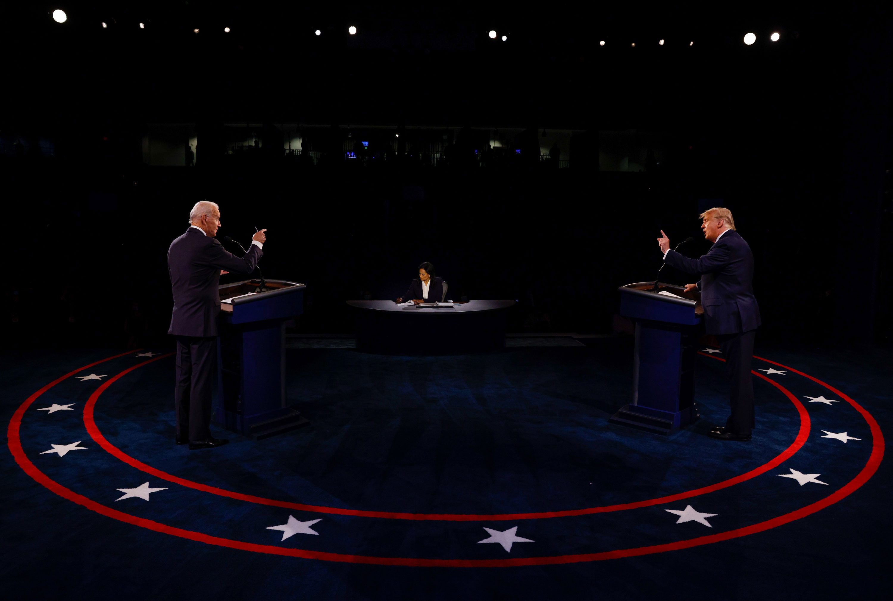 President Donald Trump, right, and Democratic candidate Joe Biden debate each other in Nashville, Tennessee, on October 22. At center is moderator Kristen Welker.