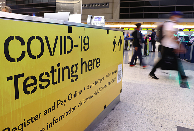 A sign promotes a COVID-19 testing location located inside the Tom Bradley International Terminal at Los Angeles International Airport (LAX) on December 01, 2021 in Los Angeles, California. 