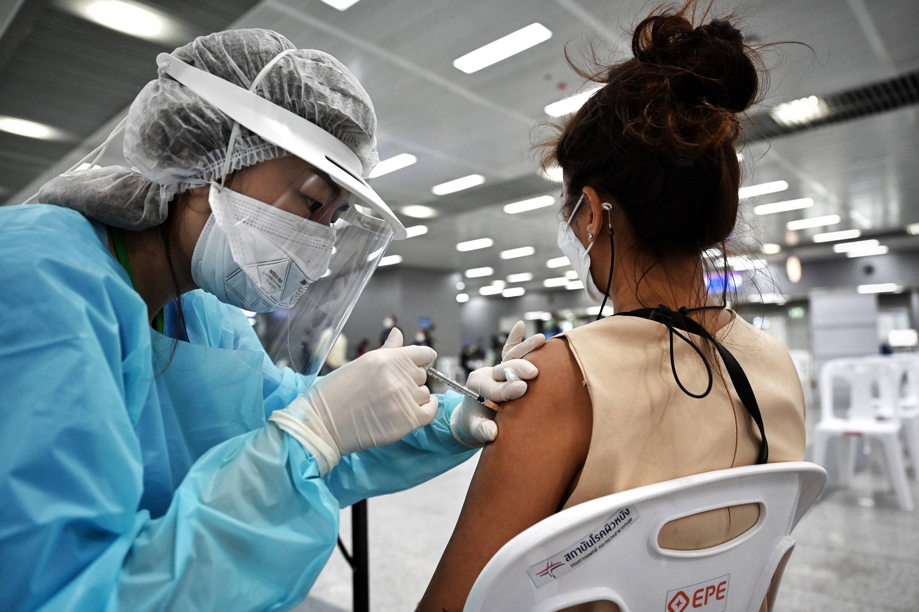 A health worker administers a dose of the Covid-19 coronavirus CoronaVac vaccine at Bang Sue Central Railway Station in Bangkok on June 22.