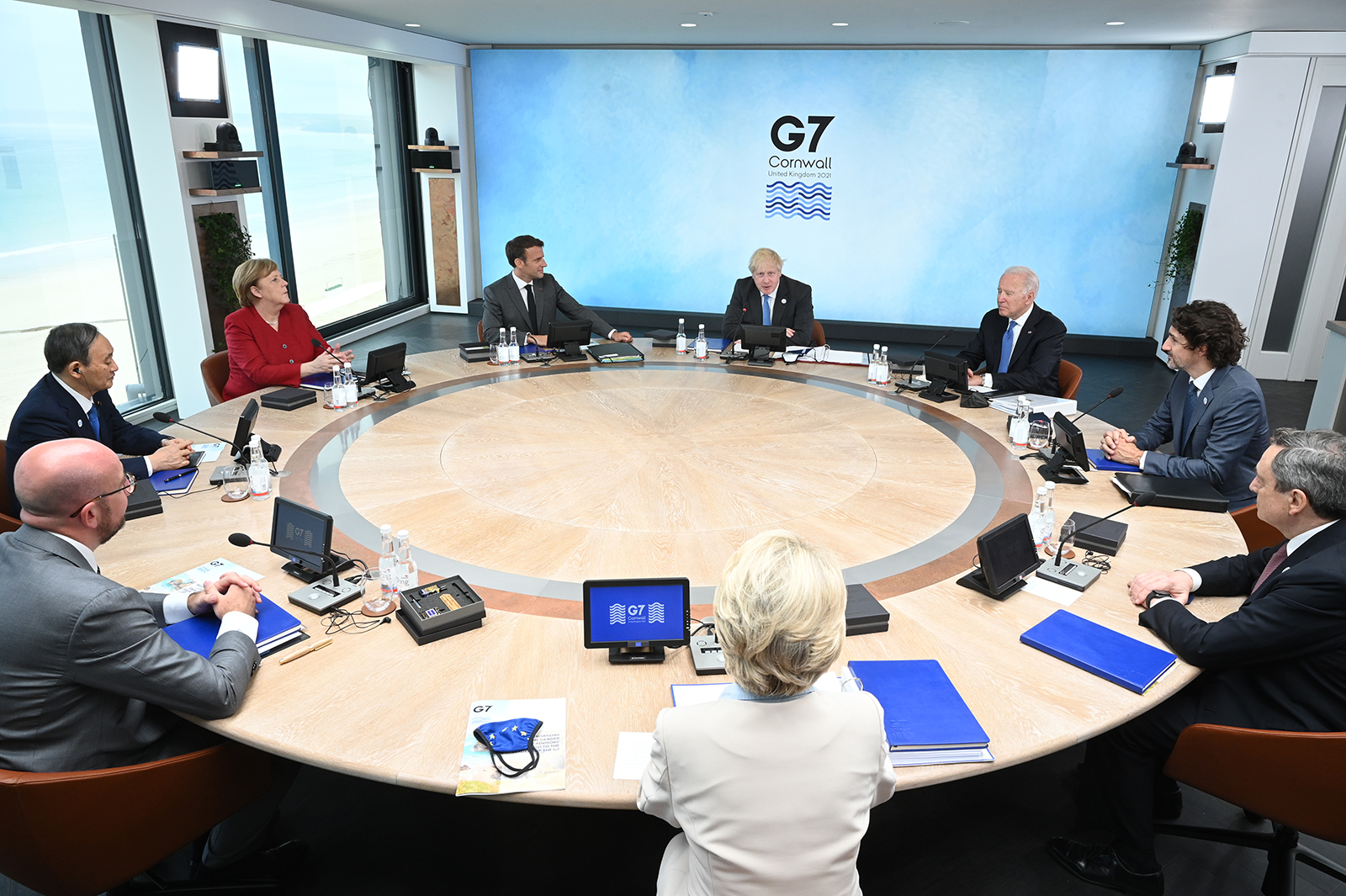 US President Joe Biden, sitting between UK Prime Minister Boris Johnson and Canada Prime Minister Justin Trudeau, participates in a meeting at the G7 in Carbis Bay near Cornwall, England, on June 11. 