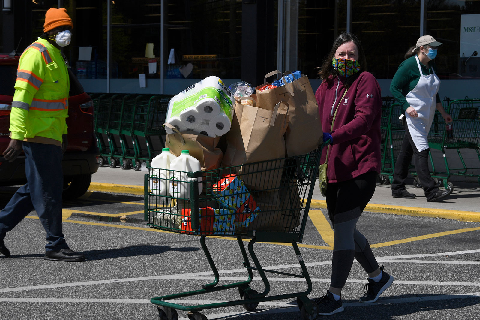 Michelle Ervin exits a grocery store while wearing a mask in Annapolis, Maryland, on April 15.
