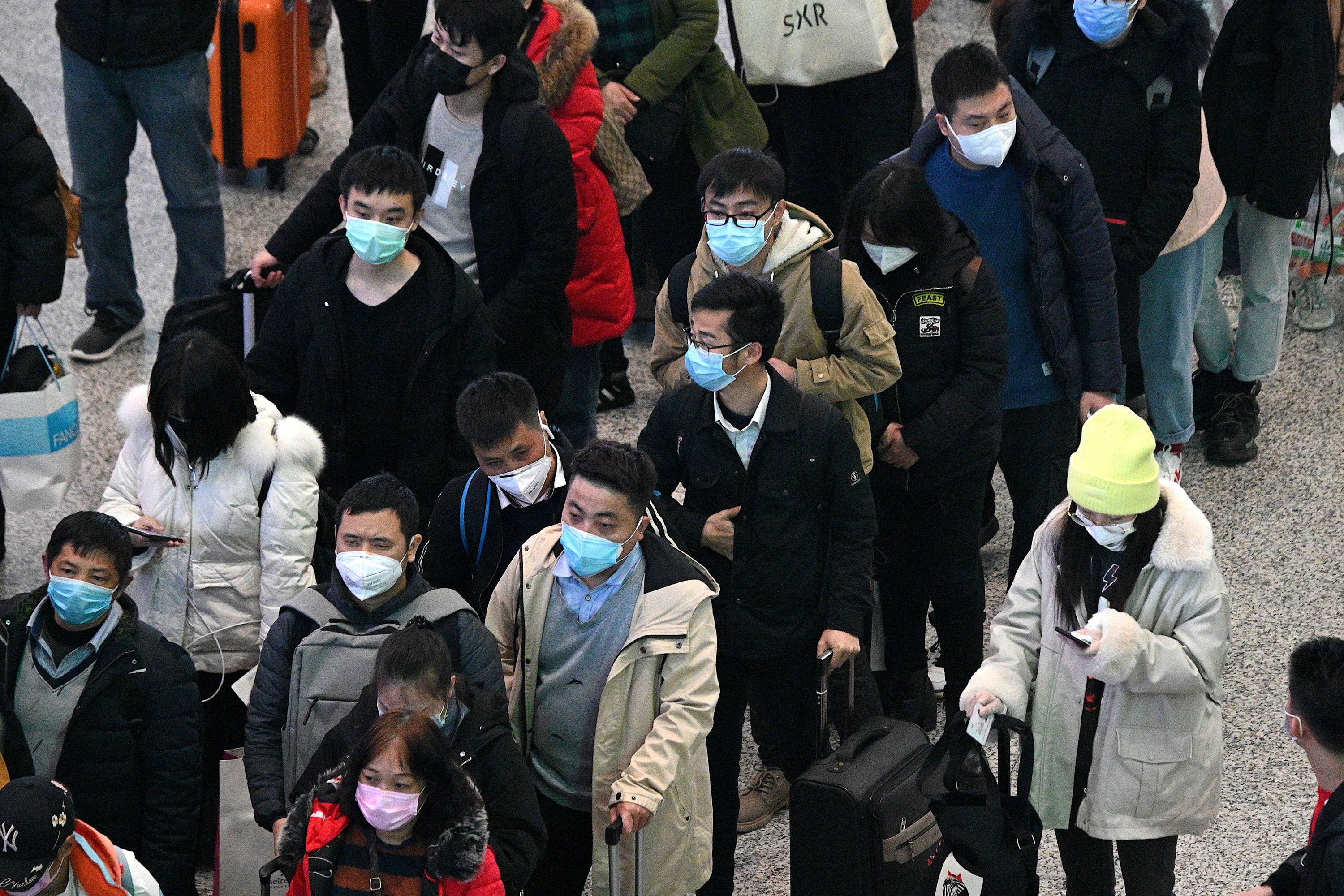 Passengers arrive at the Hongqiao railway station in Shanghai on February 26.