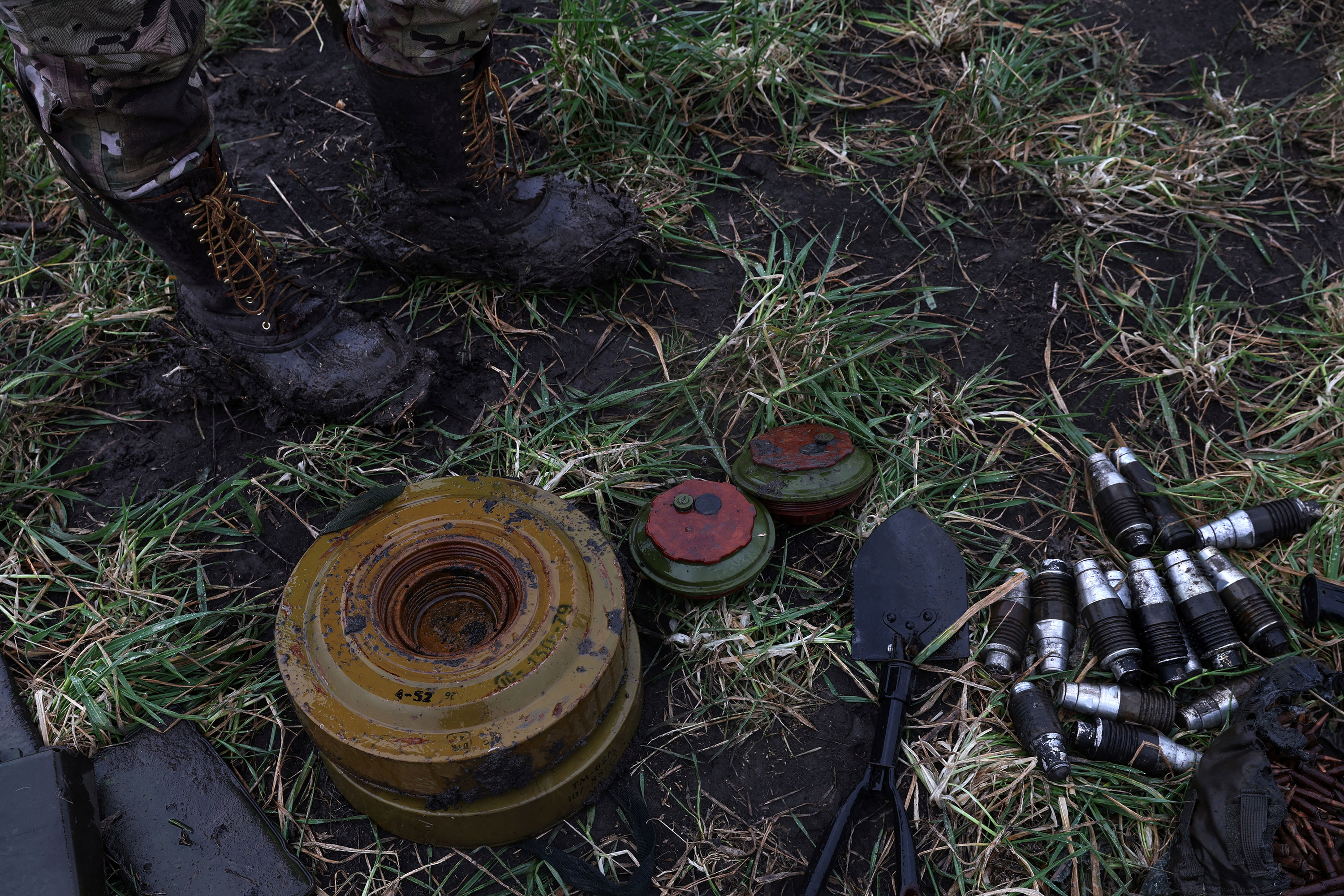 Remains of mines gathered by the Ukrainian National Guard sit in the grass in the Donetsk region of Ukraine on December 12.