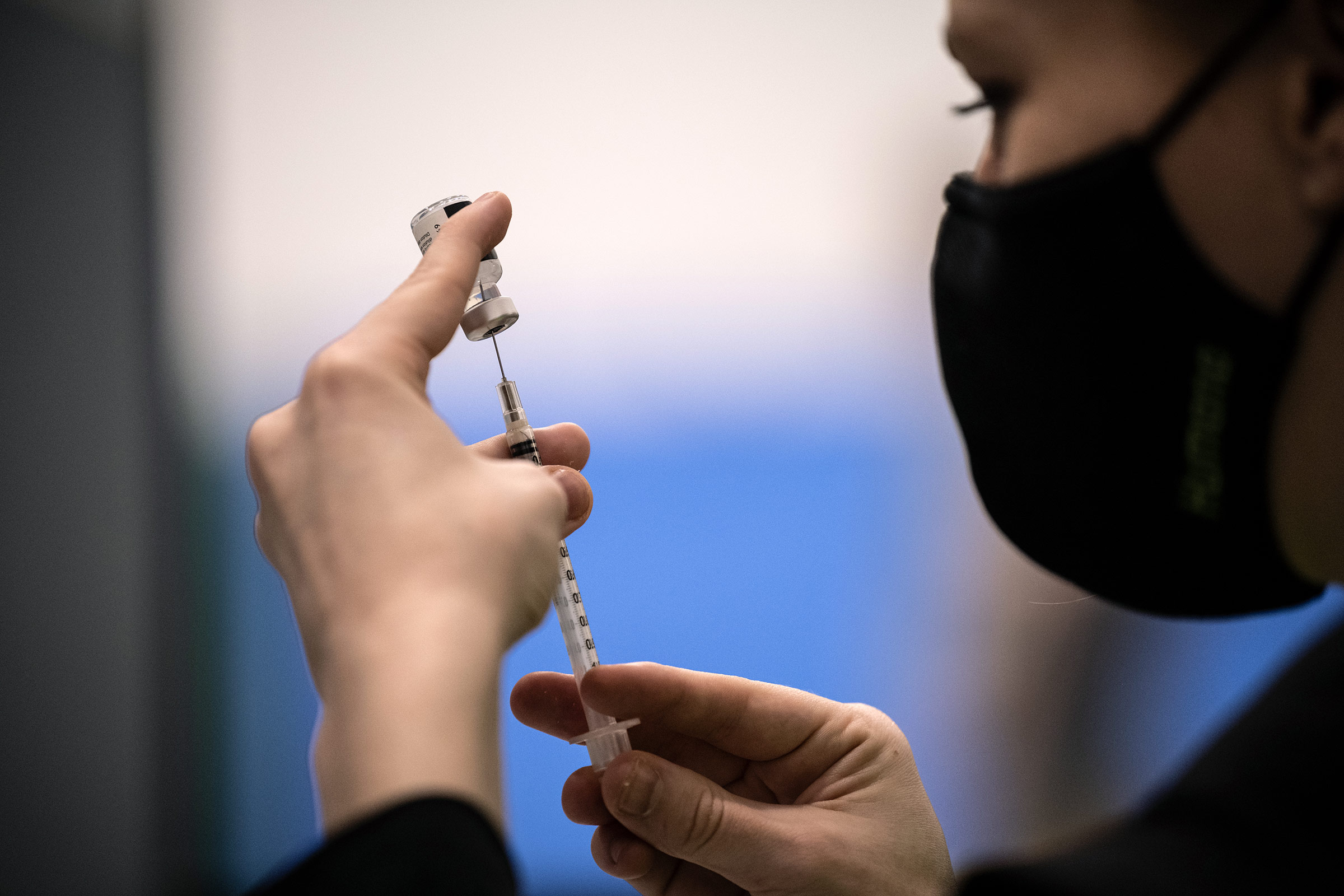 A pharmacy technician prepares a Covid-19 vaccine dose on April 2, in Louisville, Kentucky. 