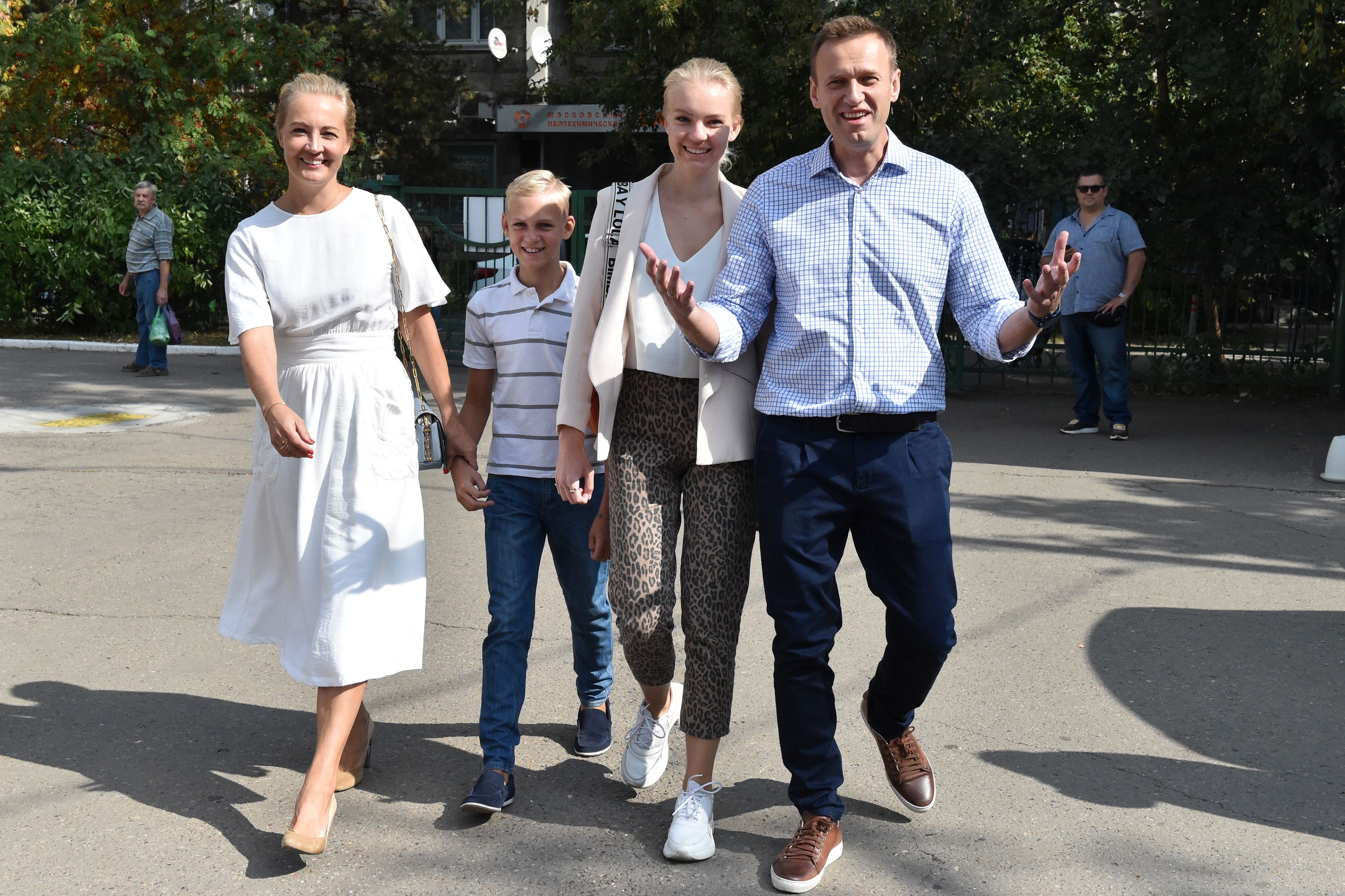 Russian opposition activist Alexei Navalny (R), his daughter Dasha (2R), son Zakhar (2L) and wife Yulia (L) arrive at a polling station during to the Moscow city Duma elections in Moscow on September 8, 2019.
