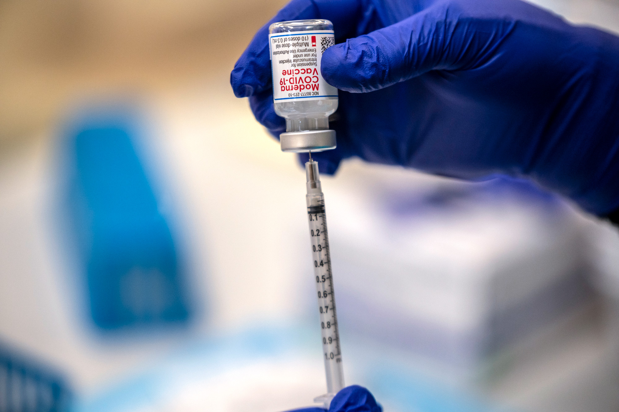 A nurse fills up a syringe with the Moderna Covid-19 vaccine at a vaccination site at a senior center on March 29 in San Antonio, Texas. 