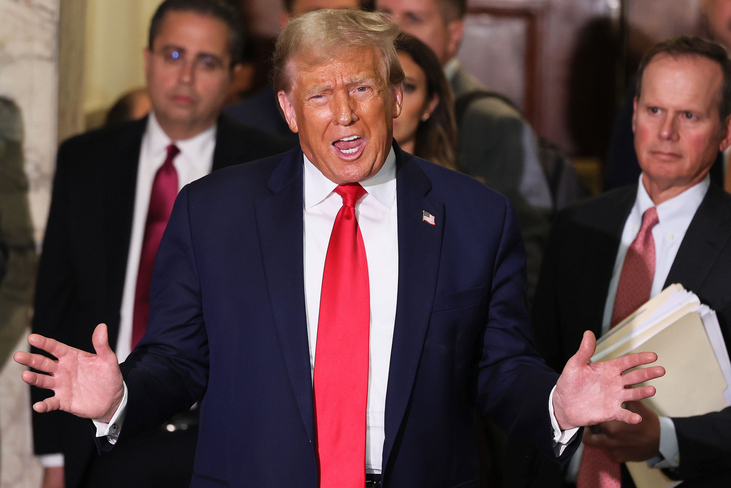 Former President Donald Trump speaks to the press during a break in his civil fraud trial at New York State Supreme Court on October 17.