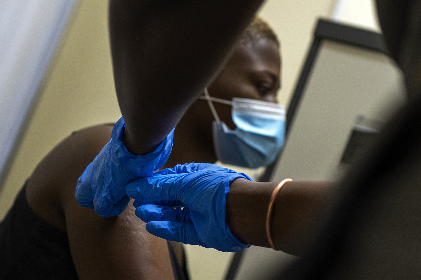 Thabisle Khlatshwayo receives her second shot at a vaccine trial facility for AstraZeneca at Soweto's Chris Sani Baragwanath Hospital outside Johannesburg, South Africa, on Monday, November 30, 2020.
