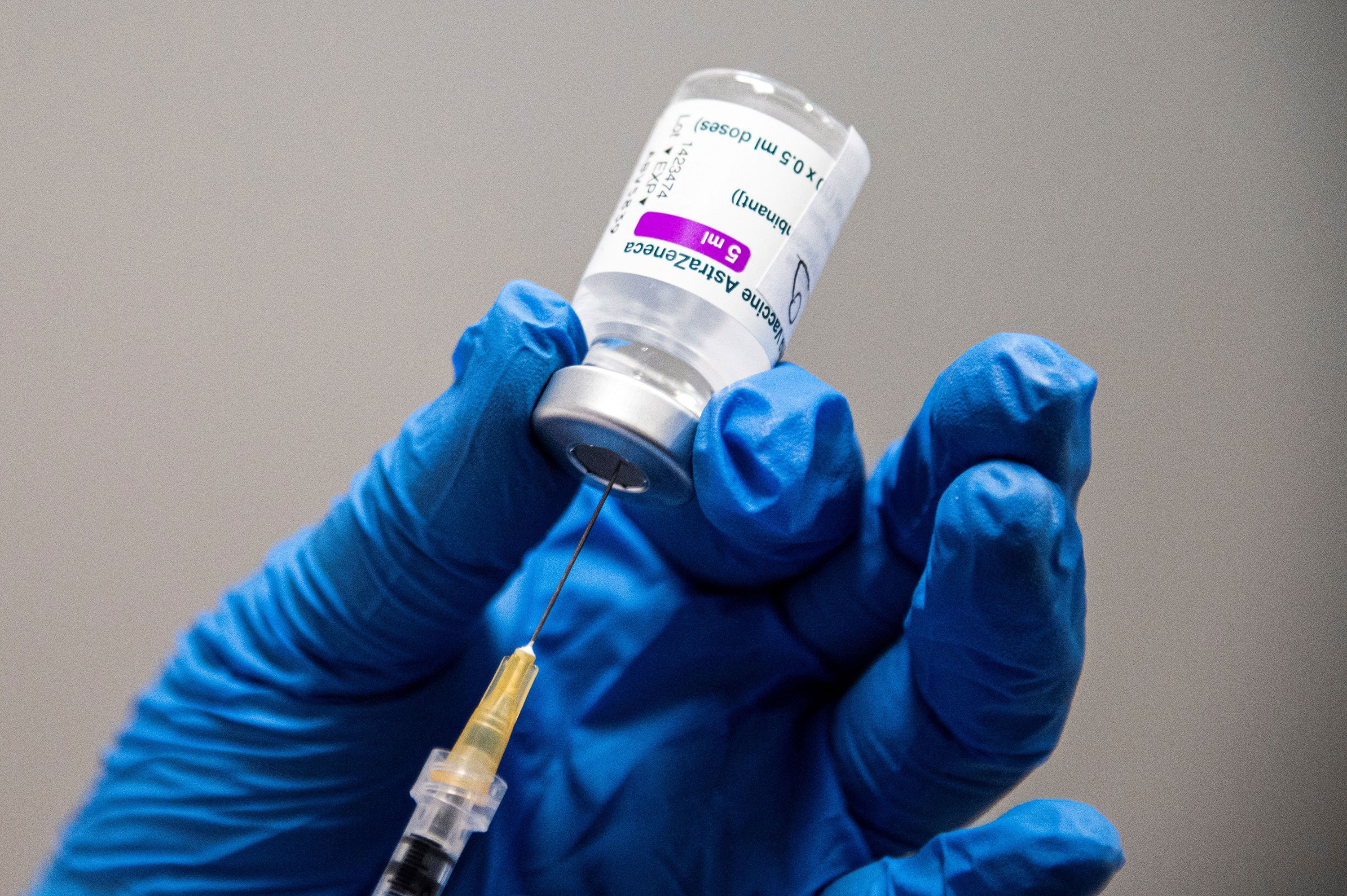 A medical worker prepares an AstraZeneca vaccine in Turin, Italy, on March 19.