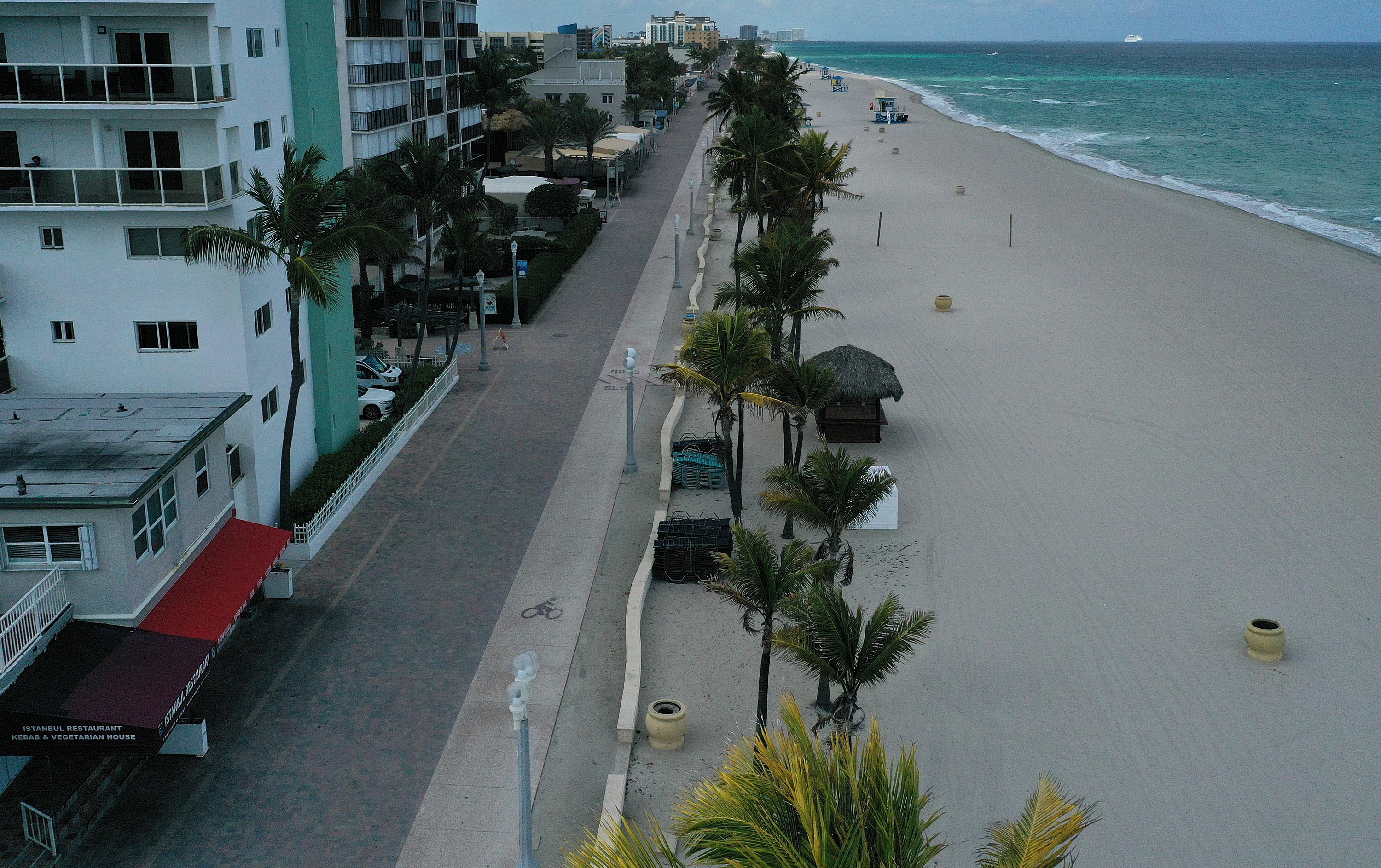 An aerial drone view shows the empty boardwalk on March 31, in Hollywood, Florida.