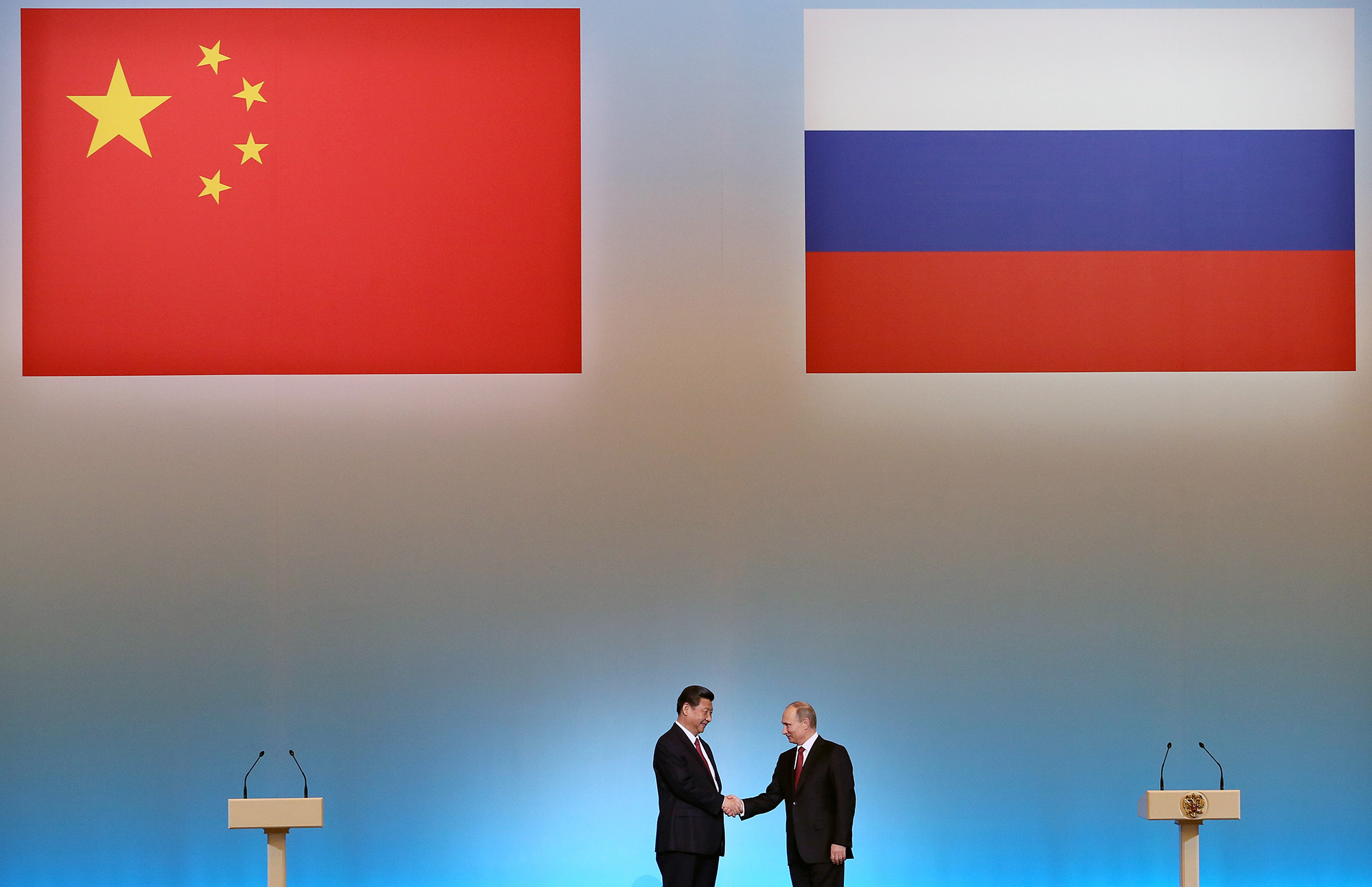 China's President Xi Jinping, left, is welcomed by his Russian counterpart Vladimir Putin during the opening ceremony of "The Year of Chinese Tourism in Russia" in Moscow, on March 22, 2013.