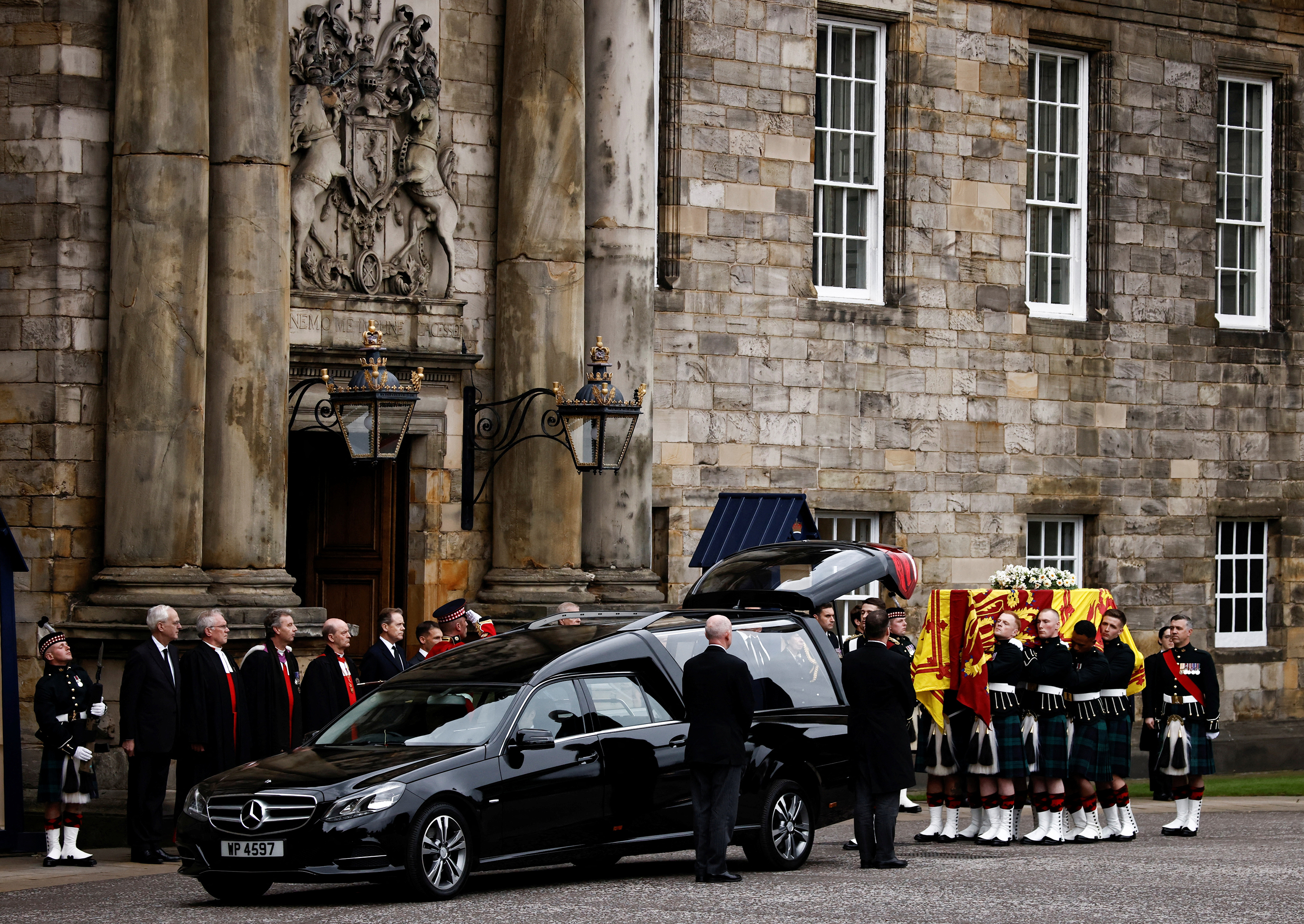 Pallbearers carry the coffin of Britain's Queen Elizabeth II as the hearse arrives at the Palace of Holyroodhouse in Edinburgh, Scotland, Britain, on September 11.