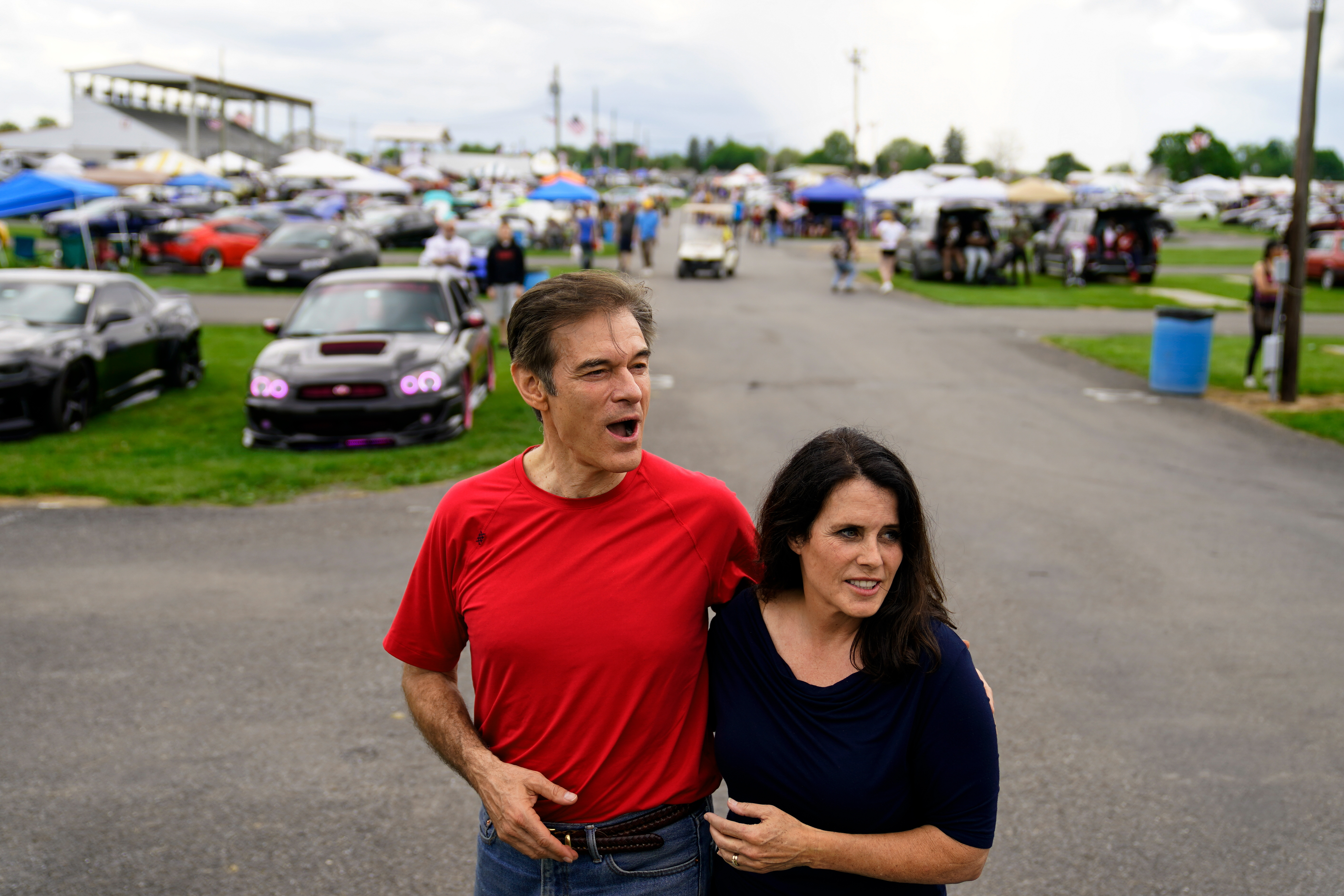 Mehmet Oz and his wife Lisa during their visit to a car show in Carlisle, Pa., on Saturday, May 14. 