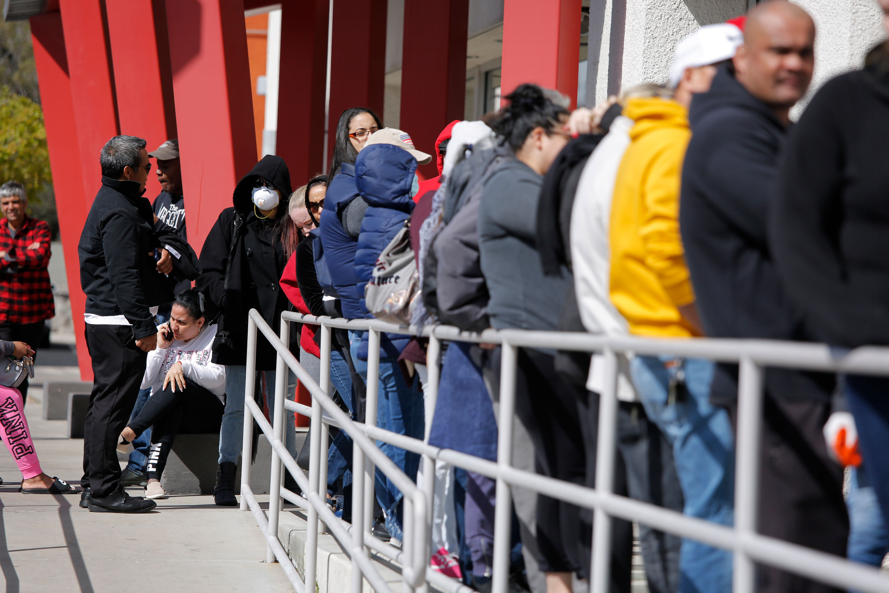 People wait in line for help with unemployment benefits on March 17 at the One-Stop Career Center in Las Vegas. 
