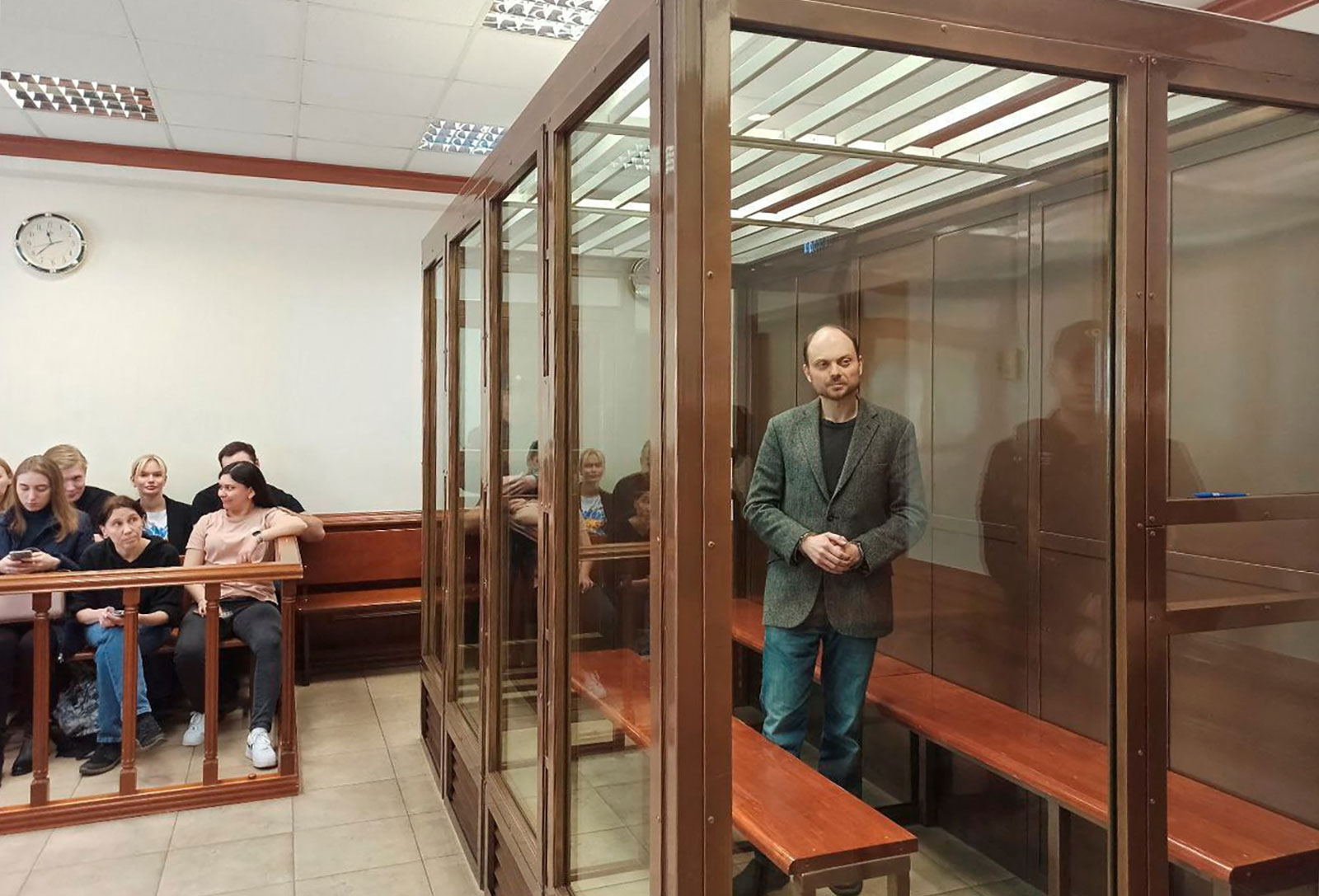 Vladimir Kara-Murza stands inside an enclosure for defendants during a court hearing in Moscow, Russia, on April 17. 