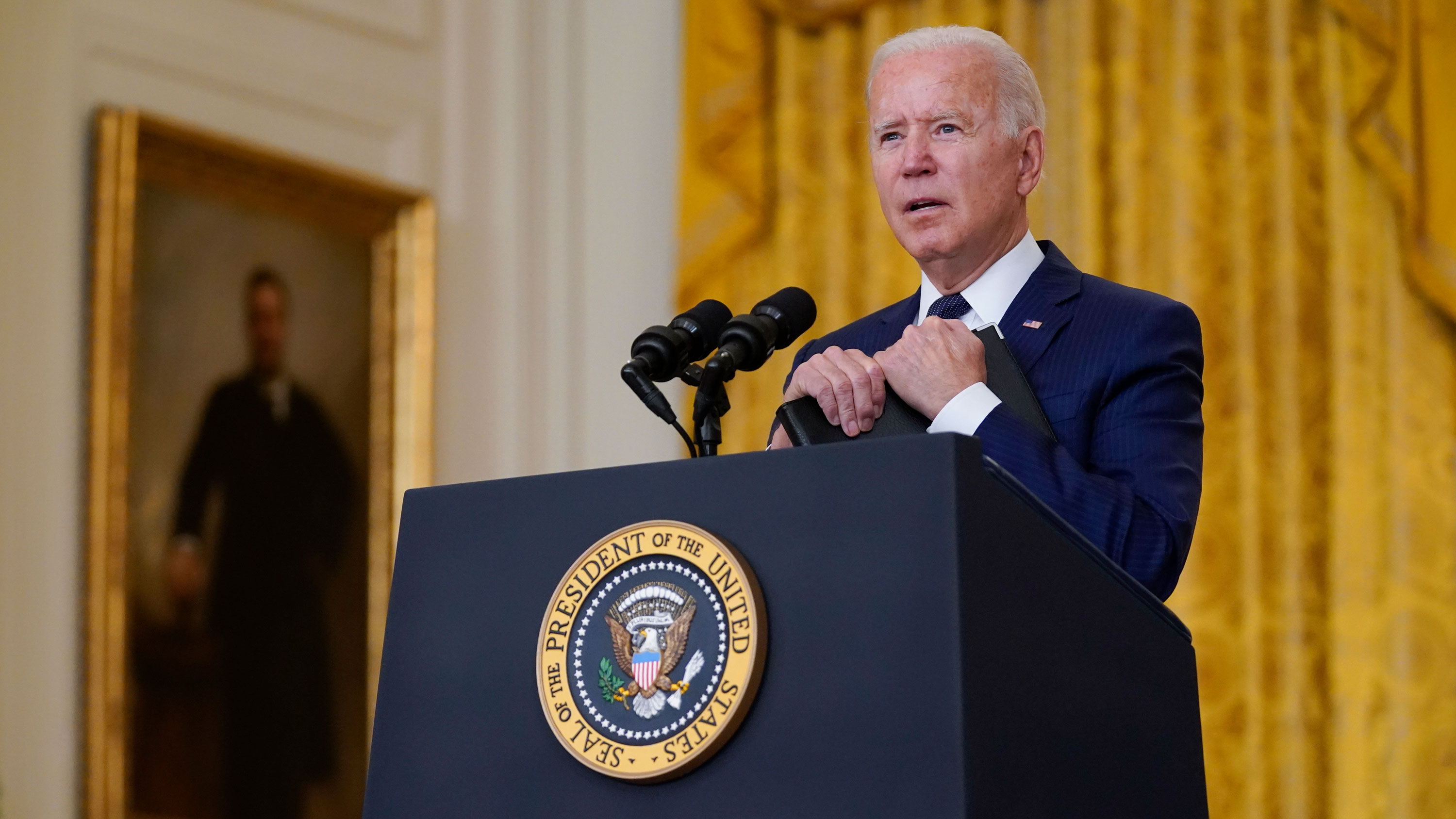 President Joe Biden answers questions from members of the media from the East Room of the White House on August 26 in Washington, DC.