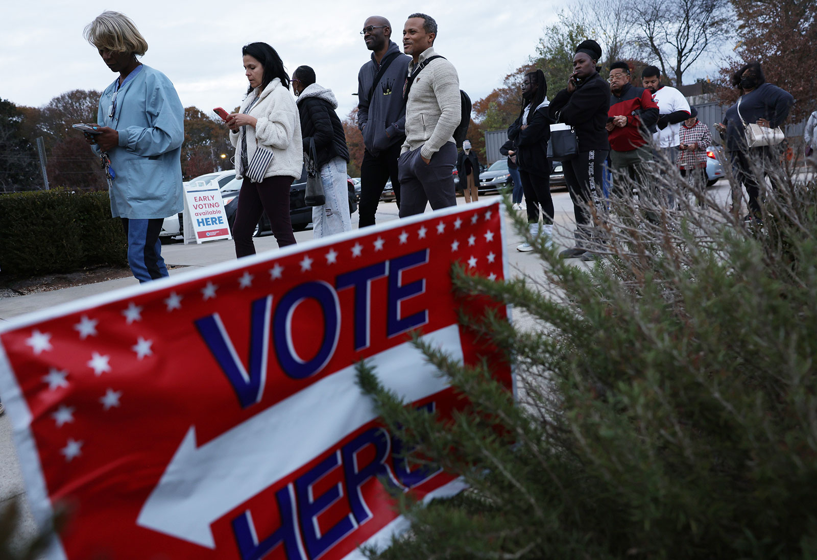 Residents wait in line to vote early outside a polling station on November 29 in Atlanta. 